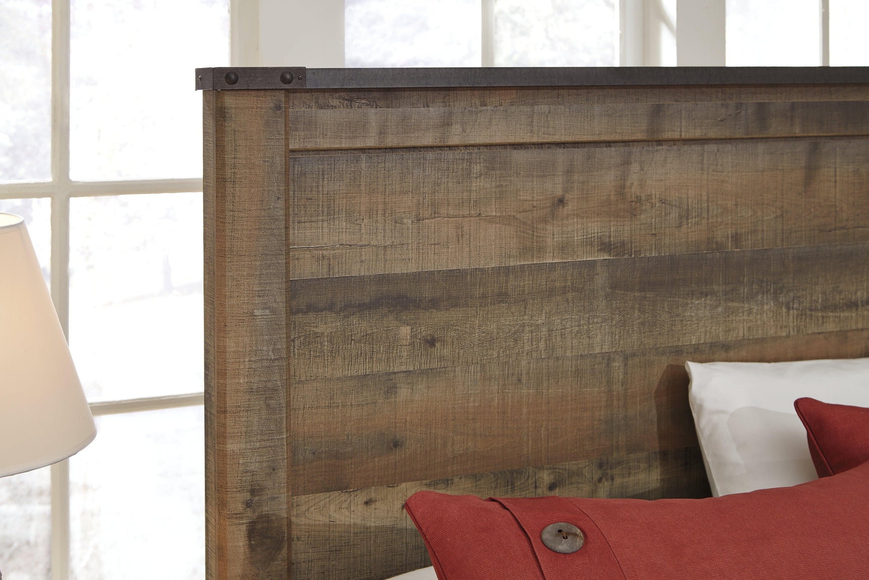 Rustic plank finish detail on Trinell twin bed