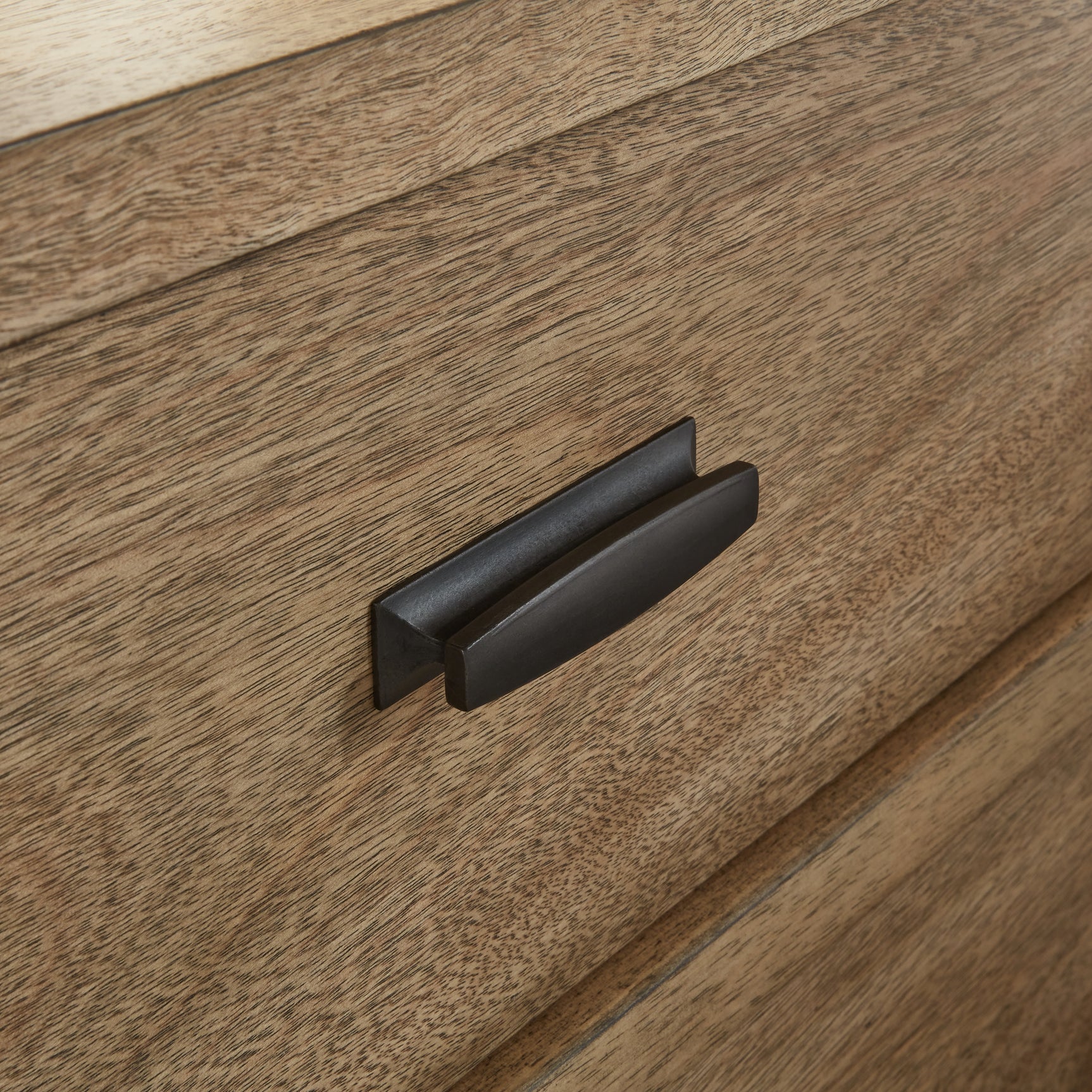 Detail of gunmetal gray metal legs on chest