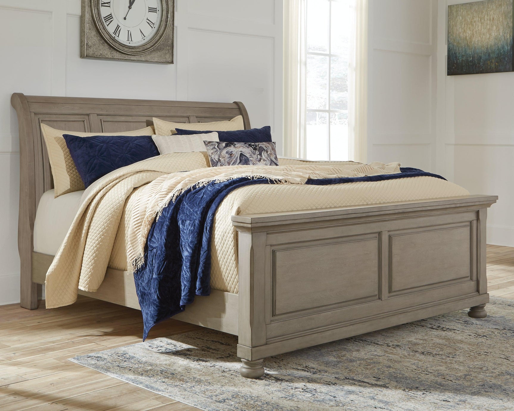 Close-up of Lettner Light Gray King Sleigh Bed headboard and bun feet