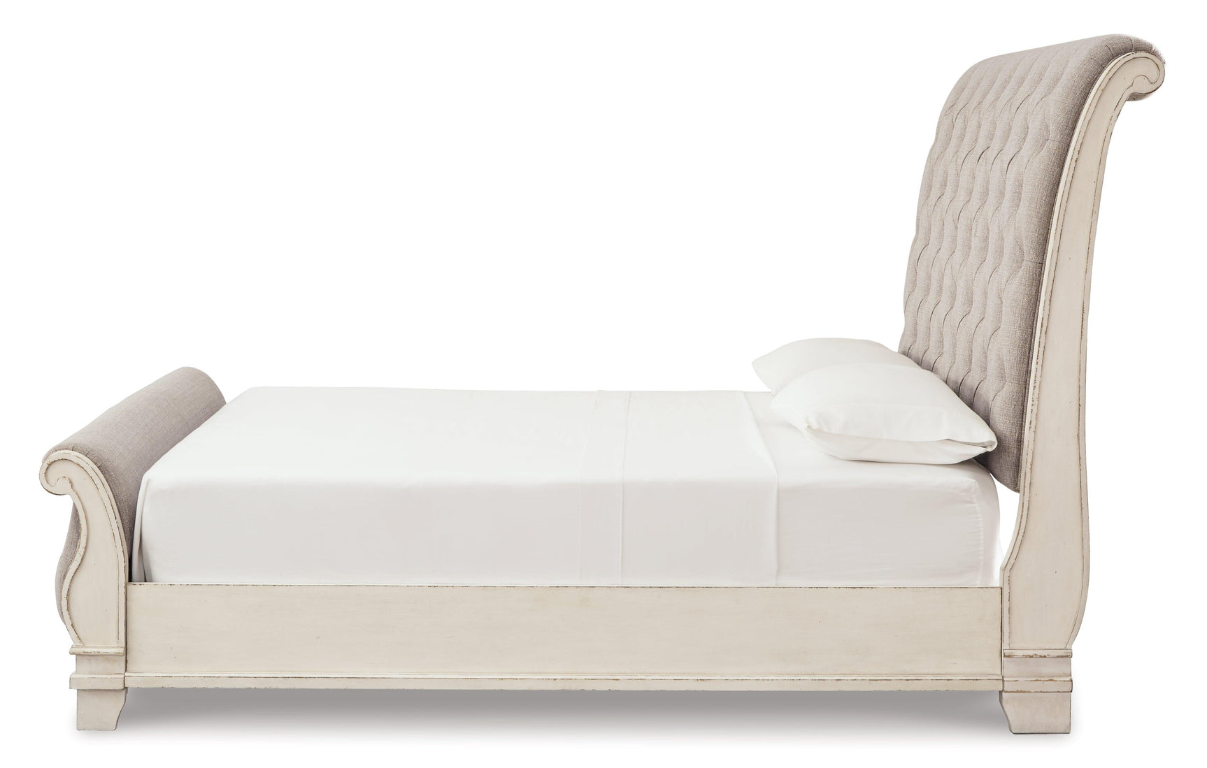 Realyn Chipped White Queen Upholstered Sleigh Bed side view showing footboard