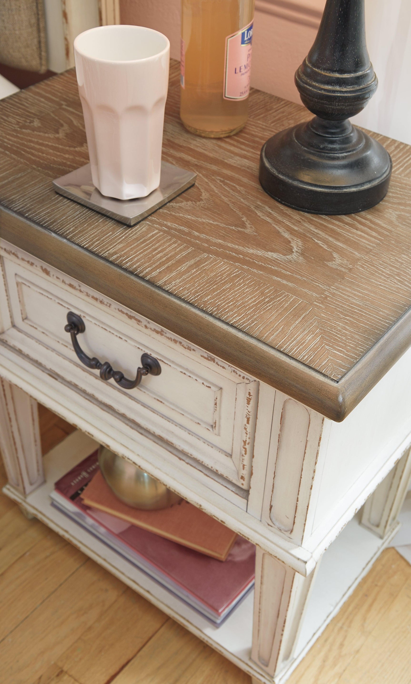 Realyn Two-Tone Nightstand with angled front view