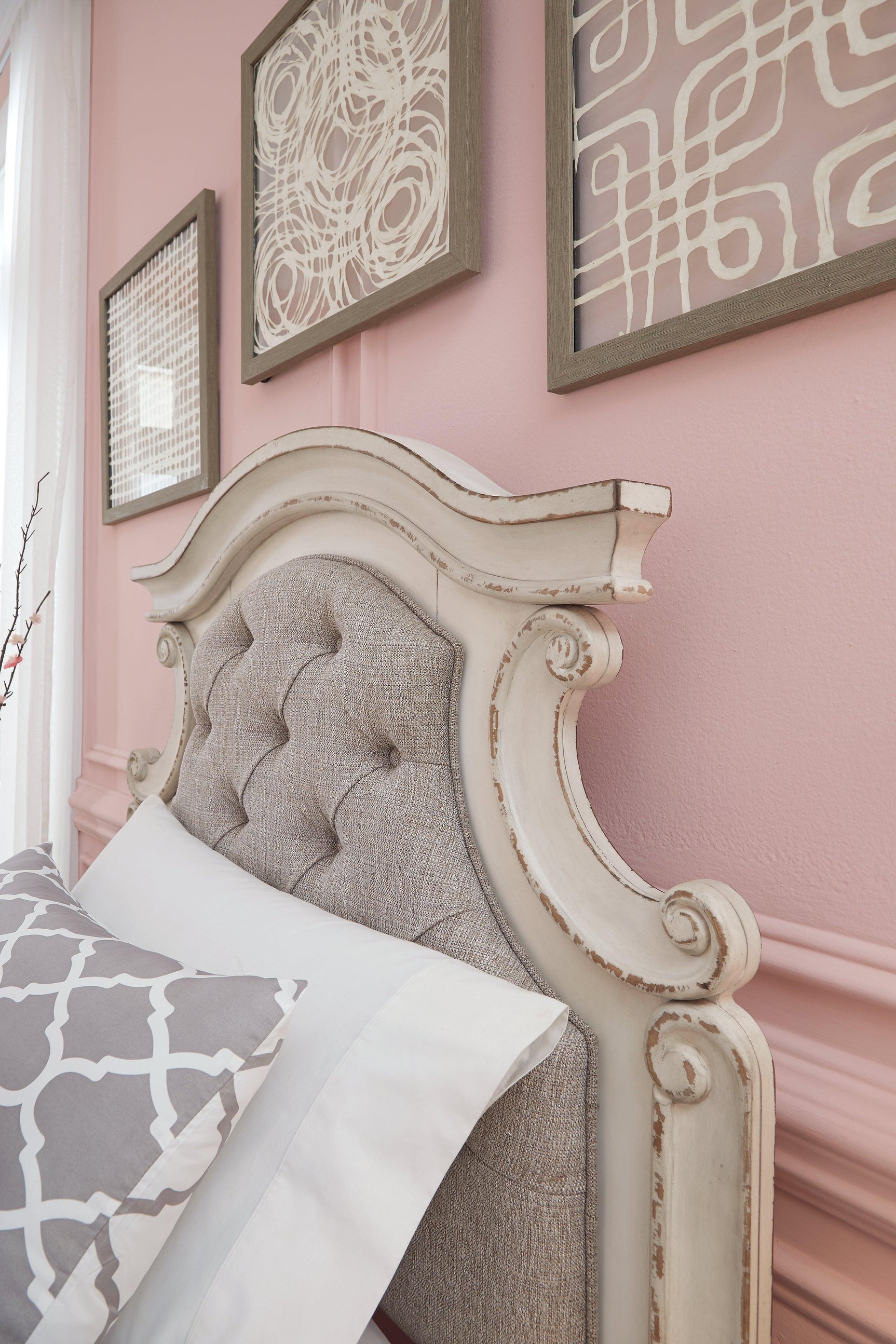 Close detail of scalloped trim and tufting on headboard