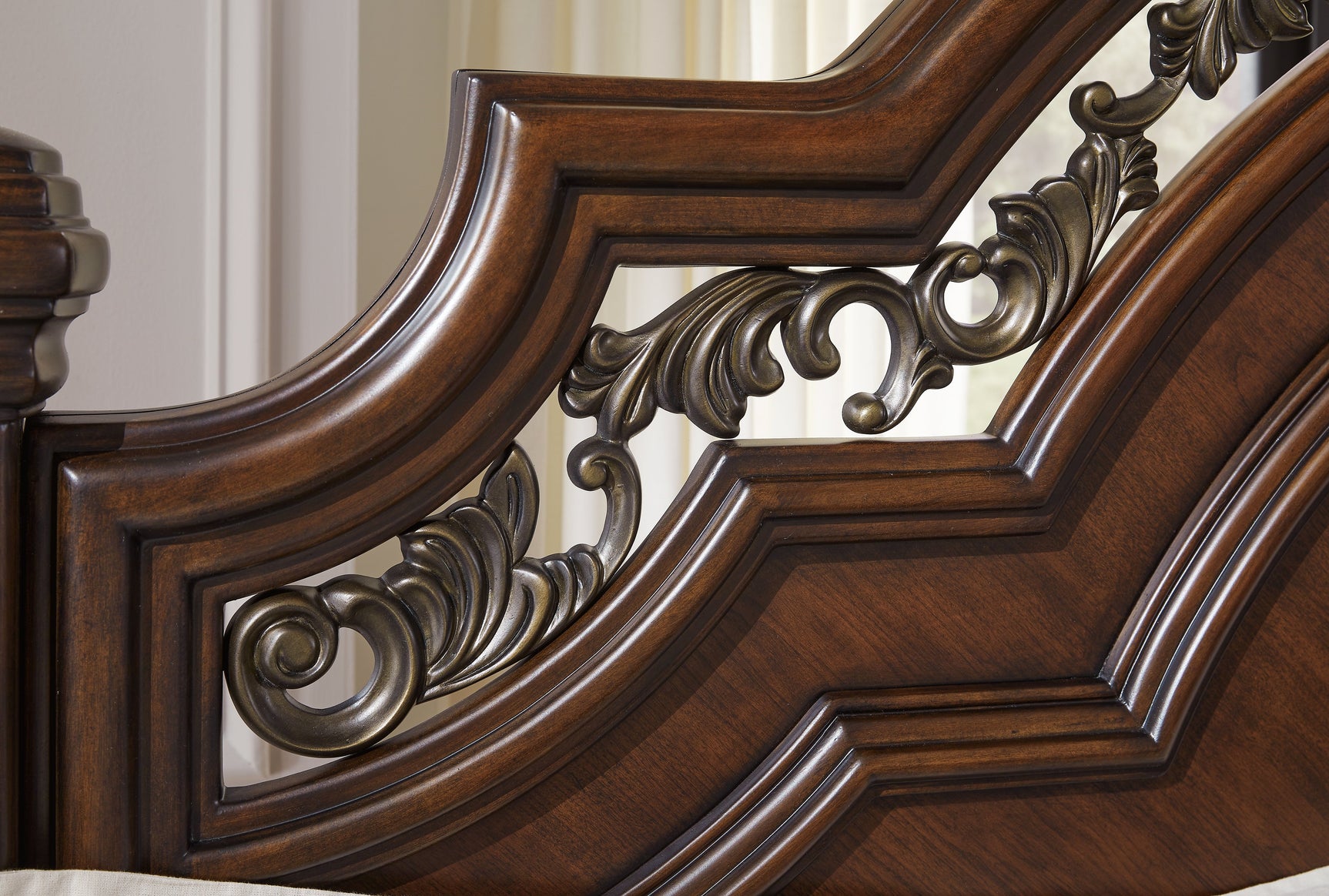 Close-up of cherry brown finish and metallic filigree