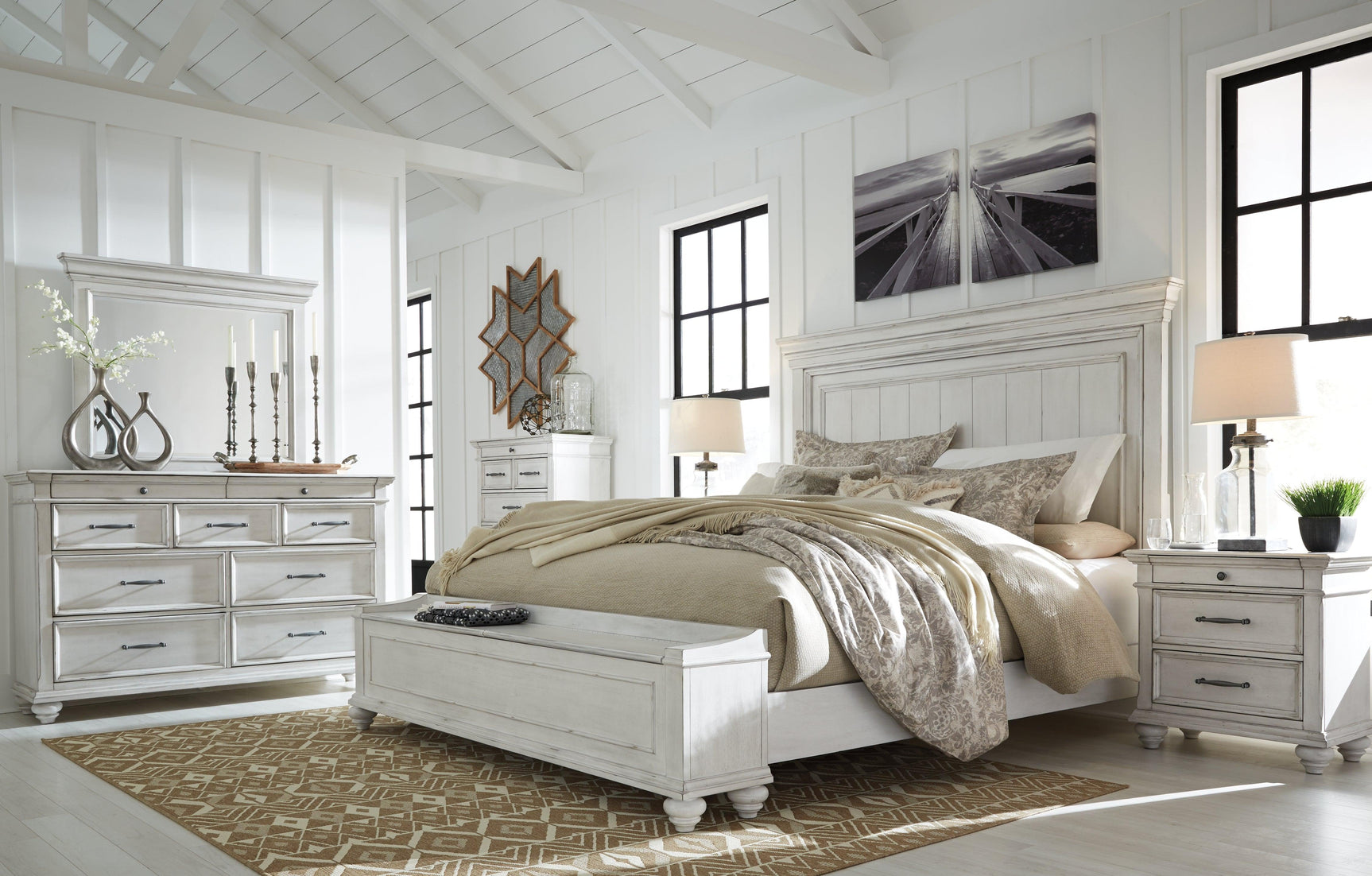 Kanwyn Whitewash Queen Panel Bed side angle with bedding
