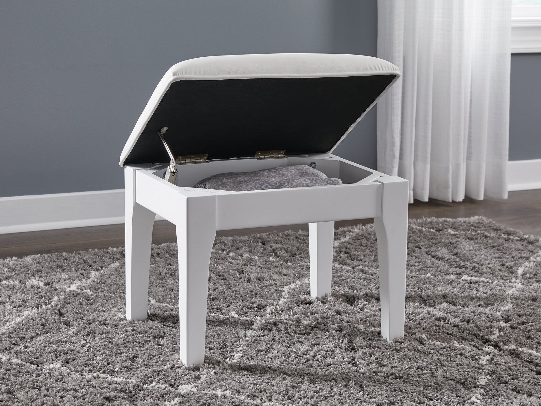 Open seat revealing hidden storage from top angle