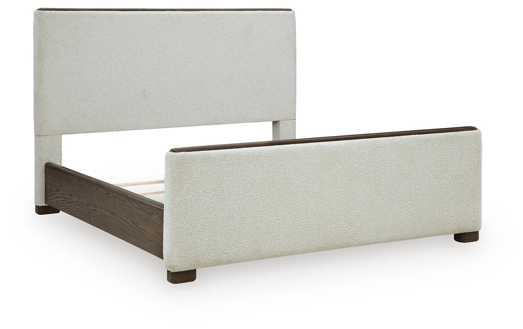 Radkin Burnished Brown King Upholstered Panel Bed angled view