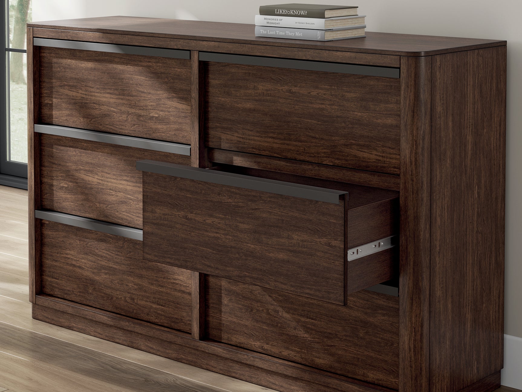 Close-up of matte black metal pulls on dresser