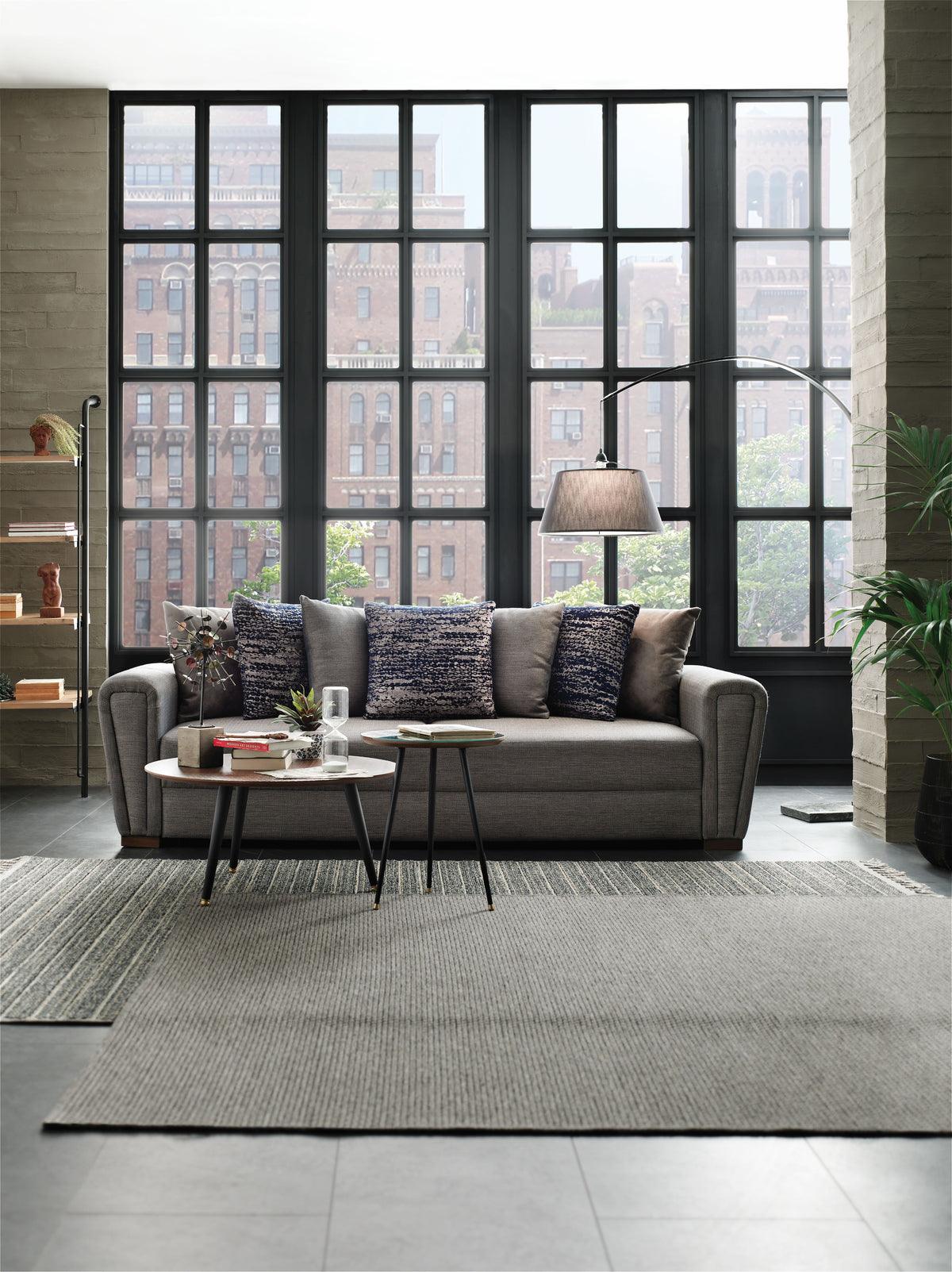 Brera sofa bed with 7 matching throw pillows arranged