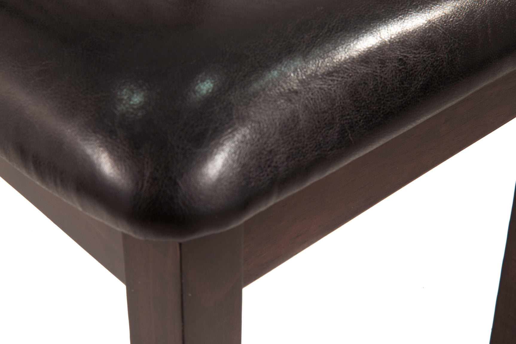 Closeup of Hammis Dark Brown Upholstered Dining Chair wood frame detail