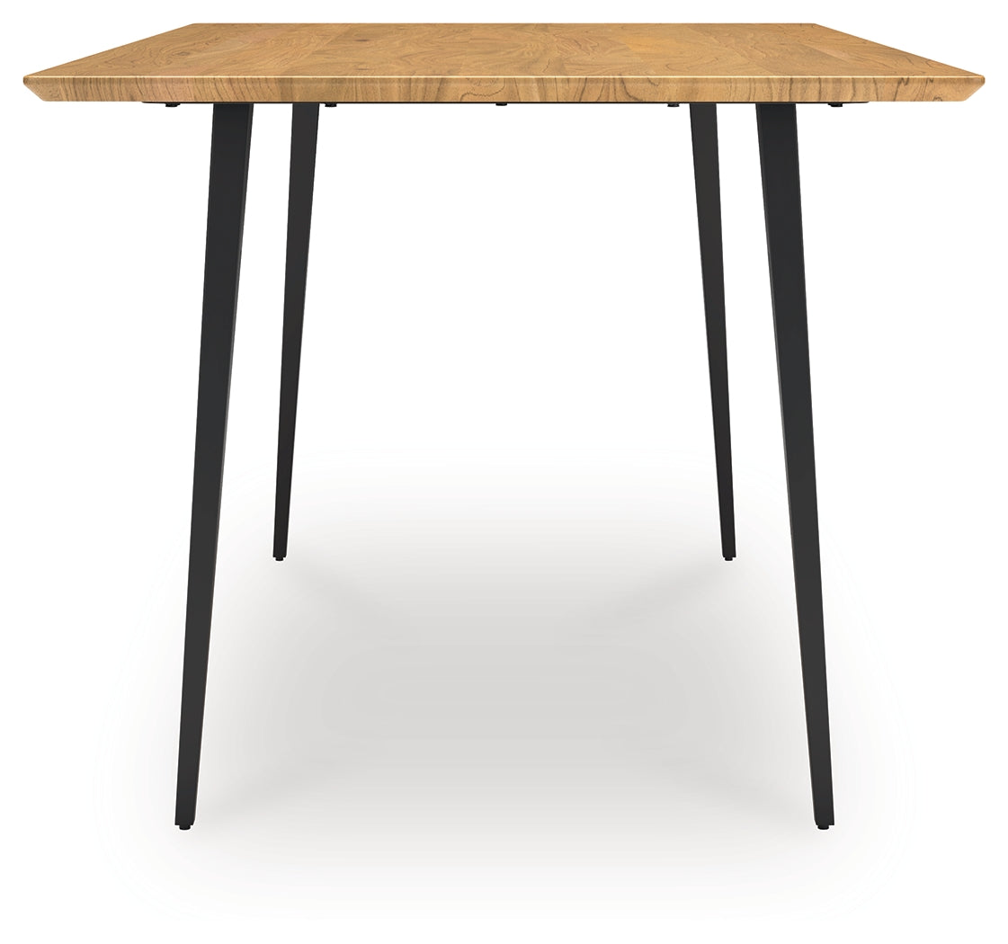 Side view of Gretlynn dining table emphasizing natural wood finish