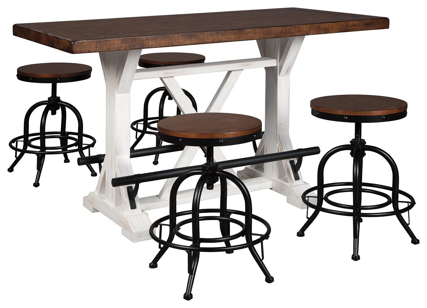 Close-up of pine wood brown tabletop and distressed vintage white base with black metal footrests