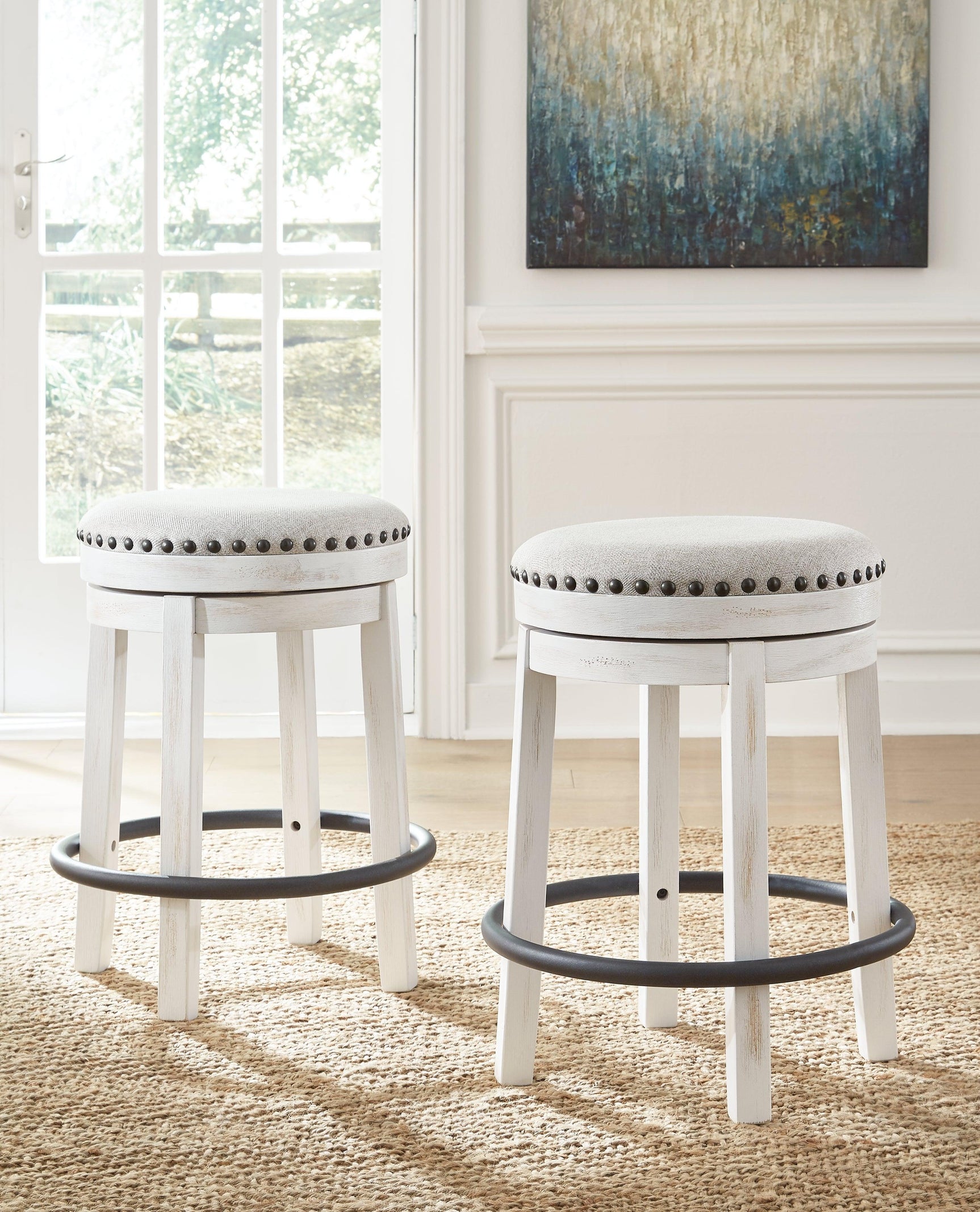 Valebeck Stool side view showing nailhead trim