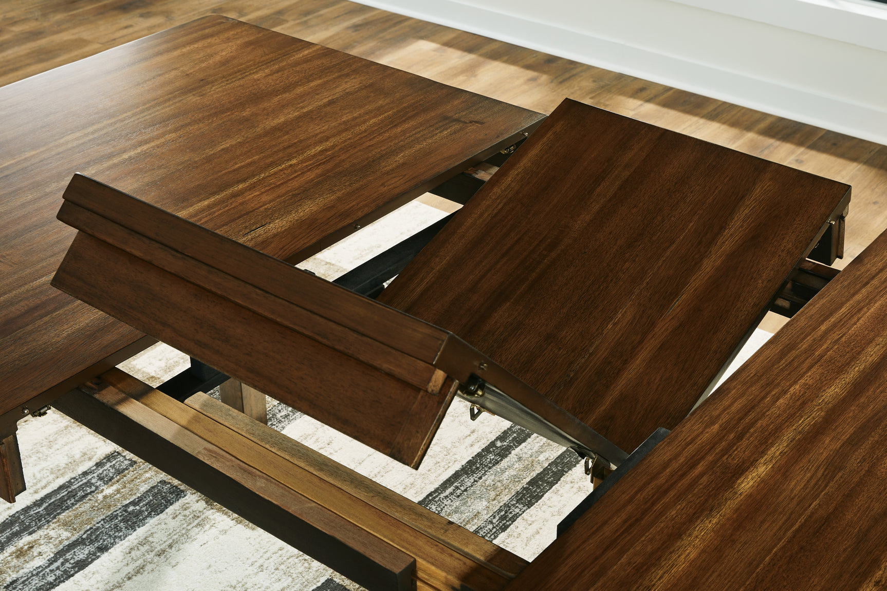 Detail of distressed and burnished medium brown finish on Ralene table