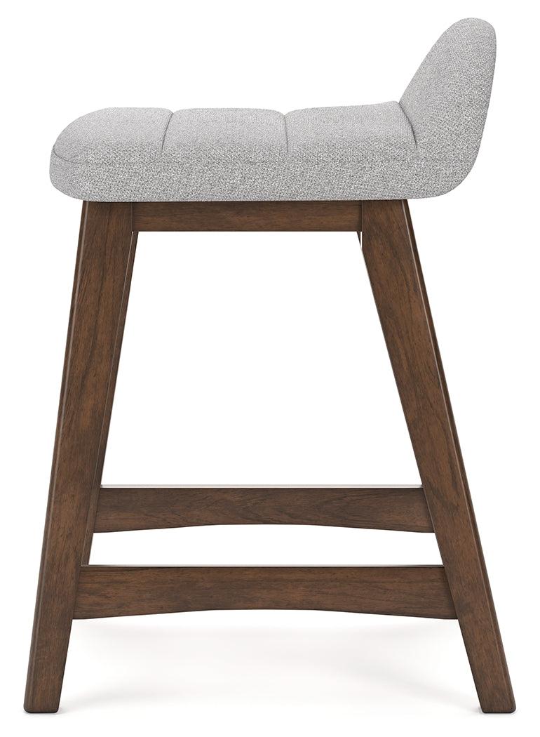 Close-up of Lyncott bar stool wood frame finish and upholstery texture