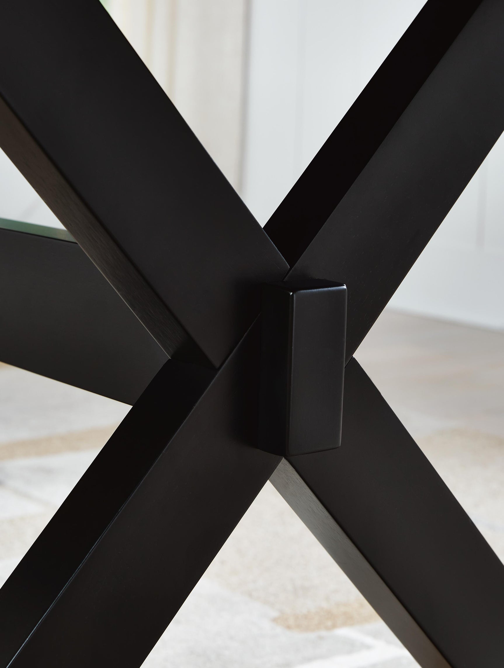 Close-up of satin black trestle base finish