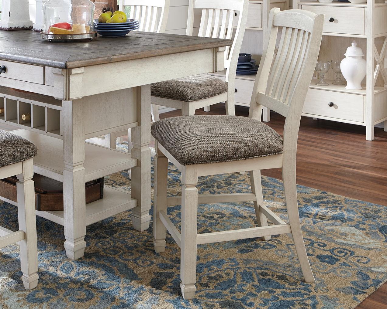 Bolanburg Two-tone Counter Height Bar Stool front angle with cushioned seat and antiqued white finish