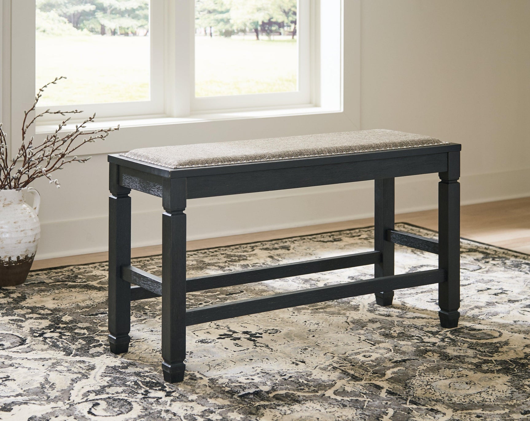 Front view showing backless upholstered seating