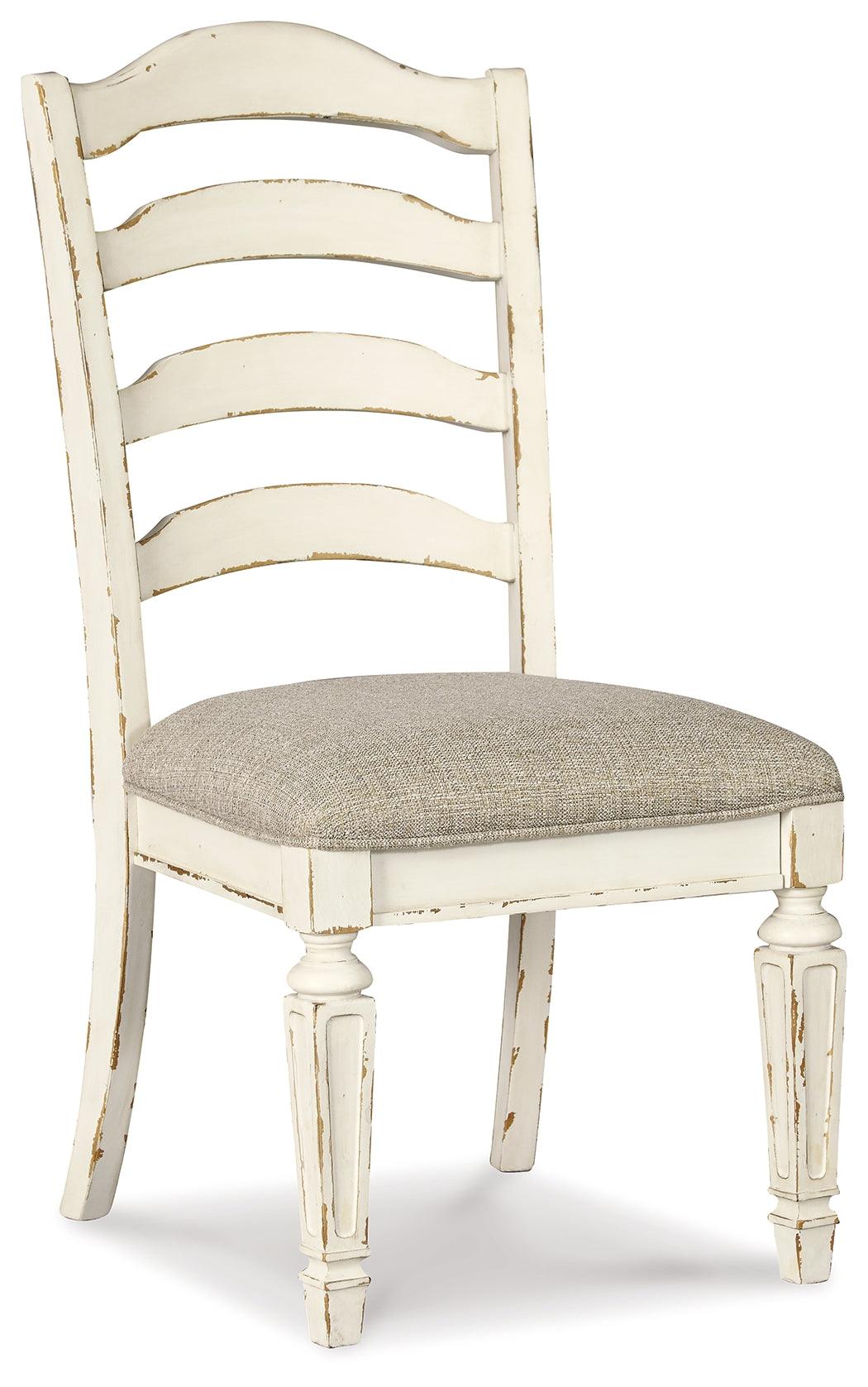 Dining setting with Realyn Chipped White Chair