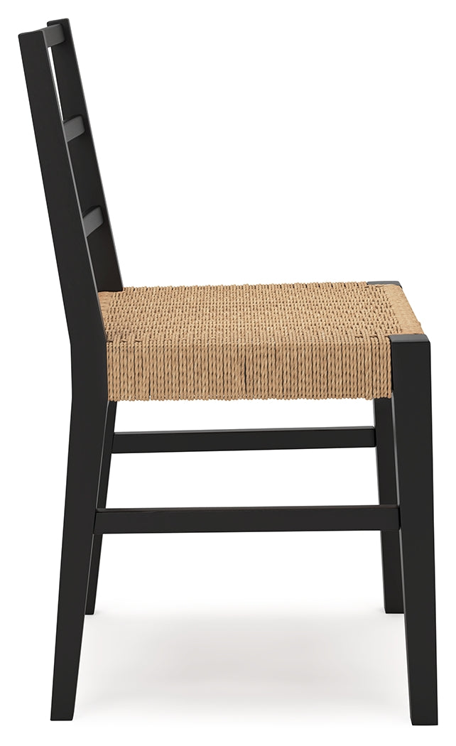 Isanti dining chair with black wood frame and rattan seat detail