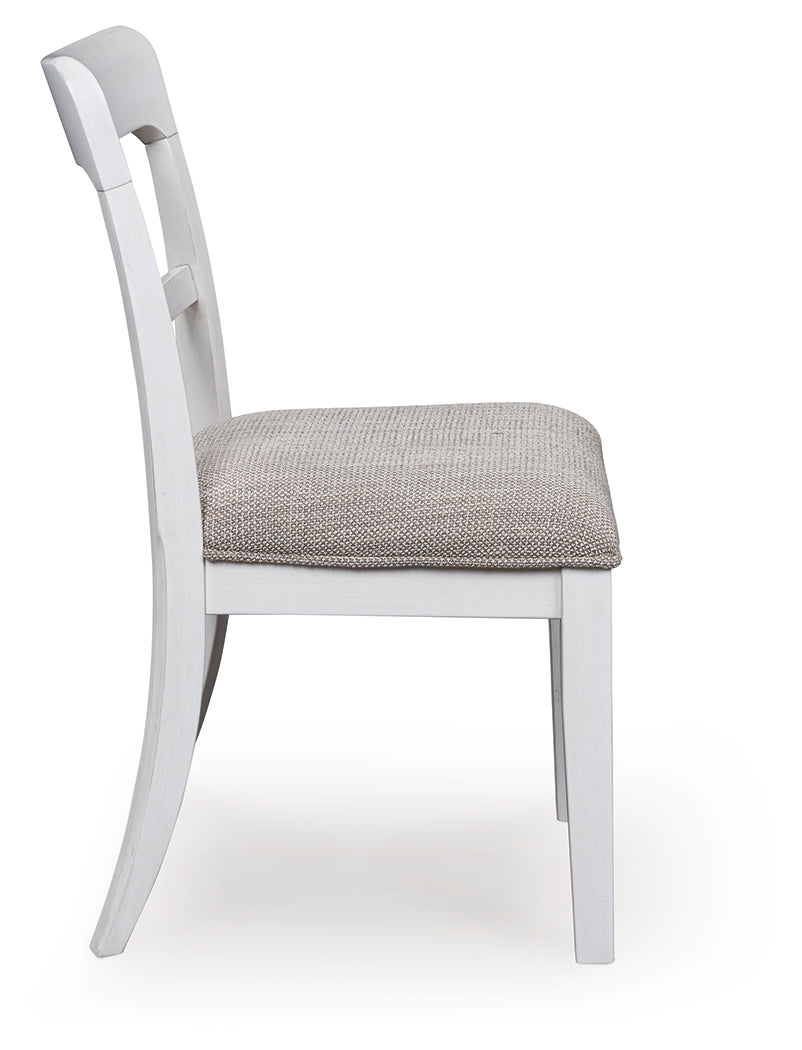Side profile of Greddinton dining chair in antiqued white finish