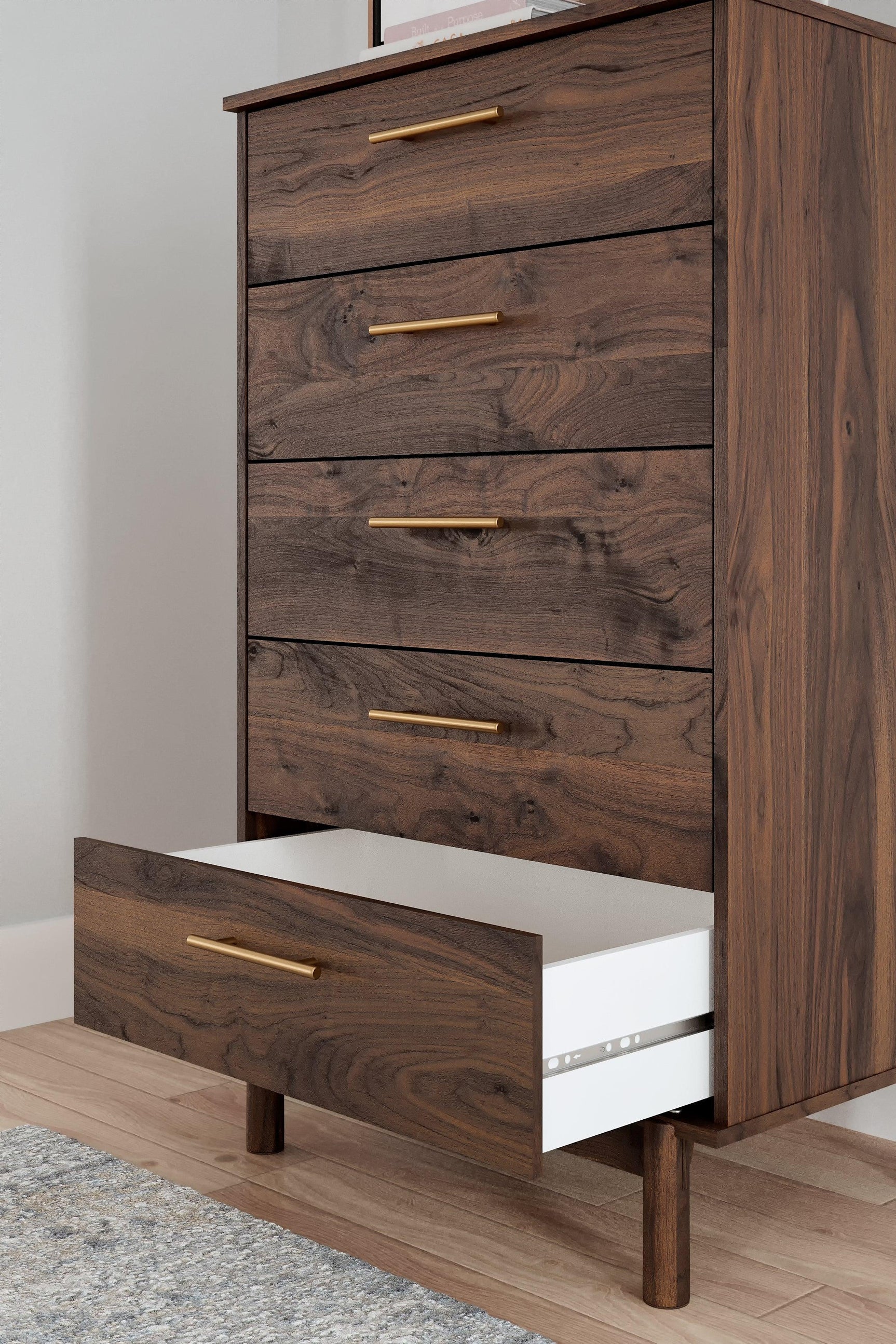 Close-up of drawer handle and wood grain finish