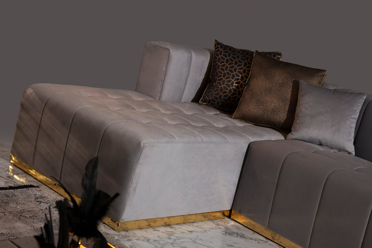 Close-up detail of sectional sofa arm and velvet fabric