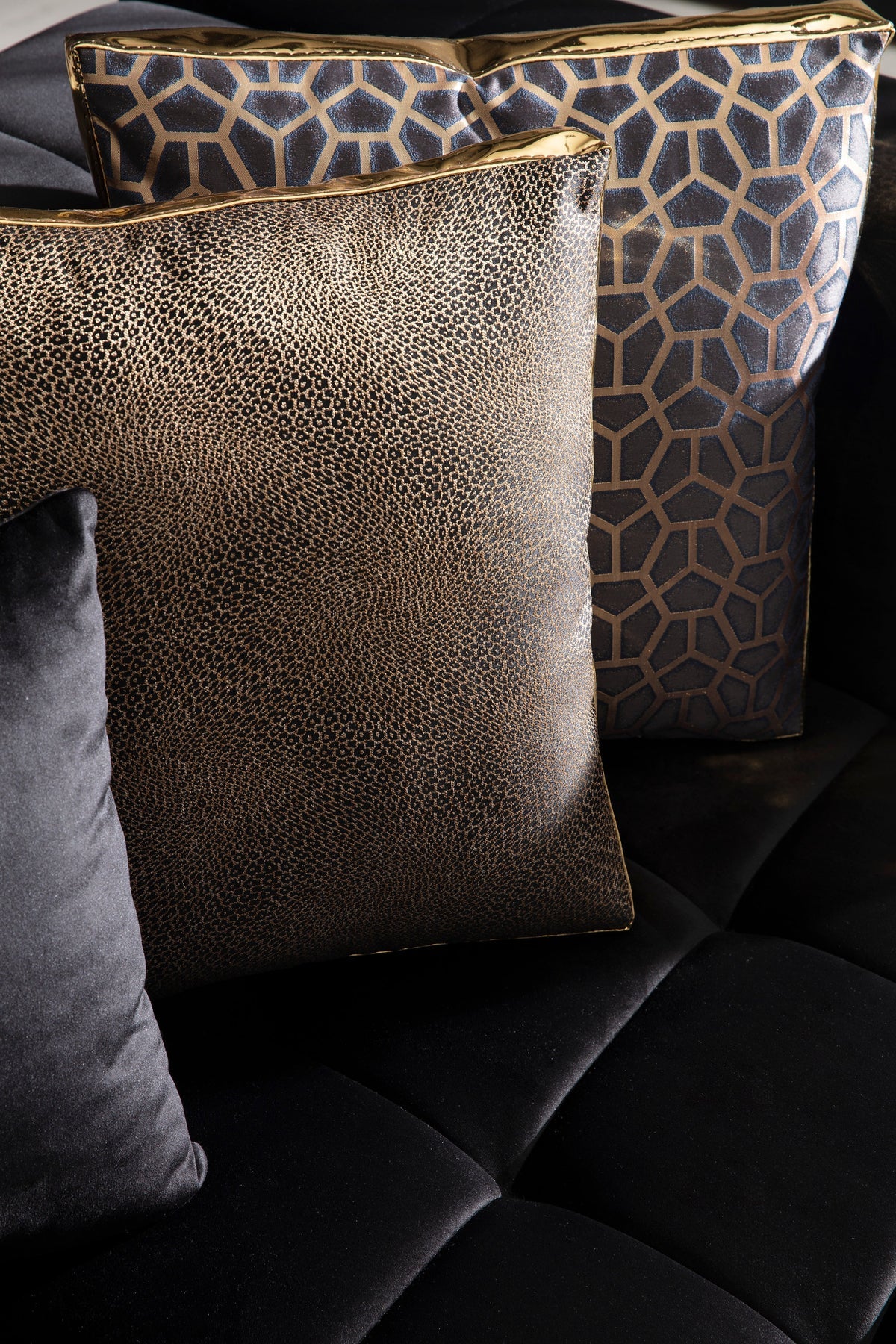 Side angle of Amelia black velvet sectional sofa