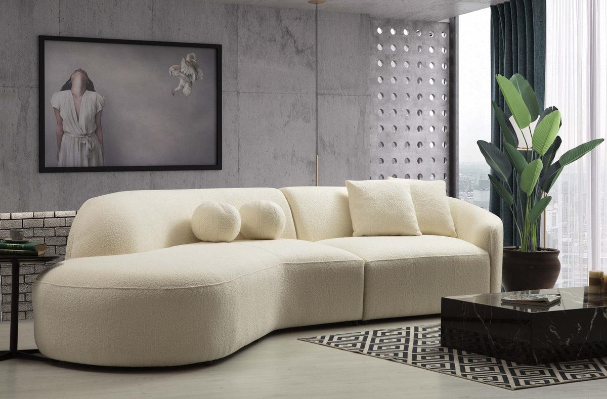 Detail of ivory bouclé upholstery on Ava Curved Sectional Sofa
