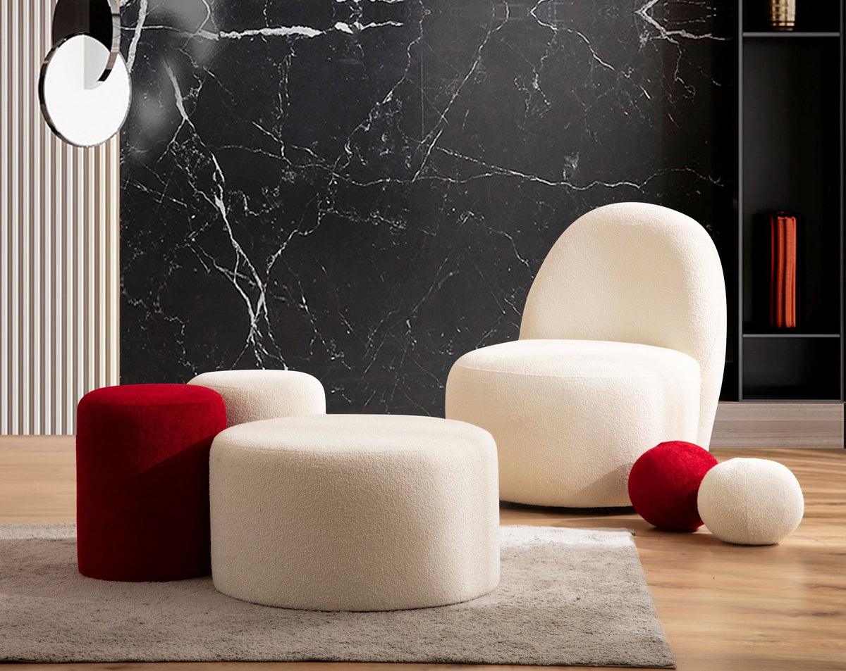 Side view of ivory boucle round ottoman