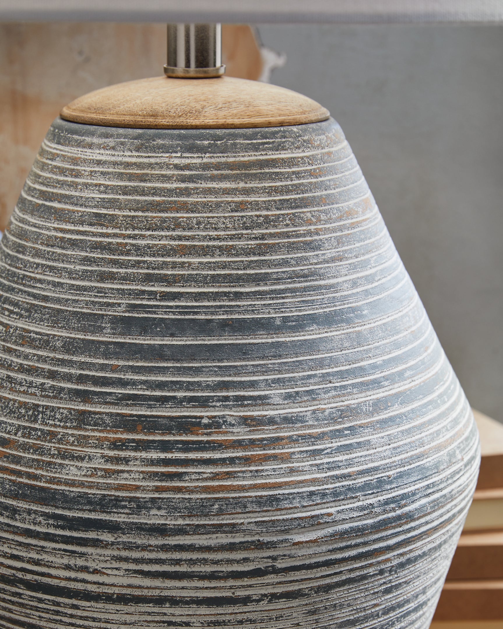 Close-up of Lawrock lamp base with natural wood accents and antique blue terra cotta
