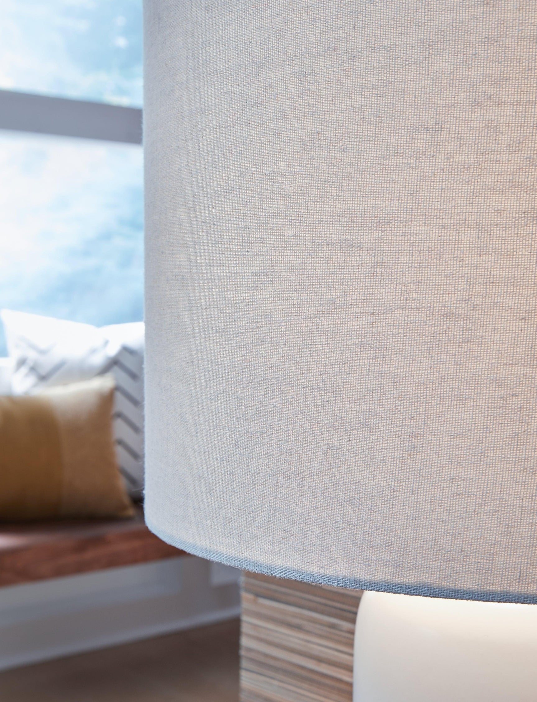Detail of the ceramic base finish on Lemrich white and teal table lamp