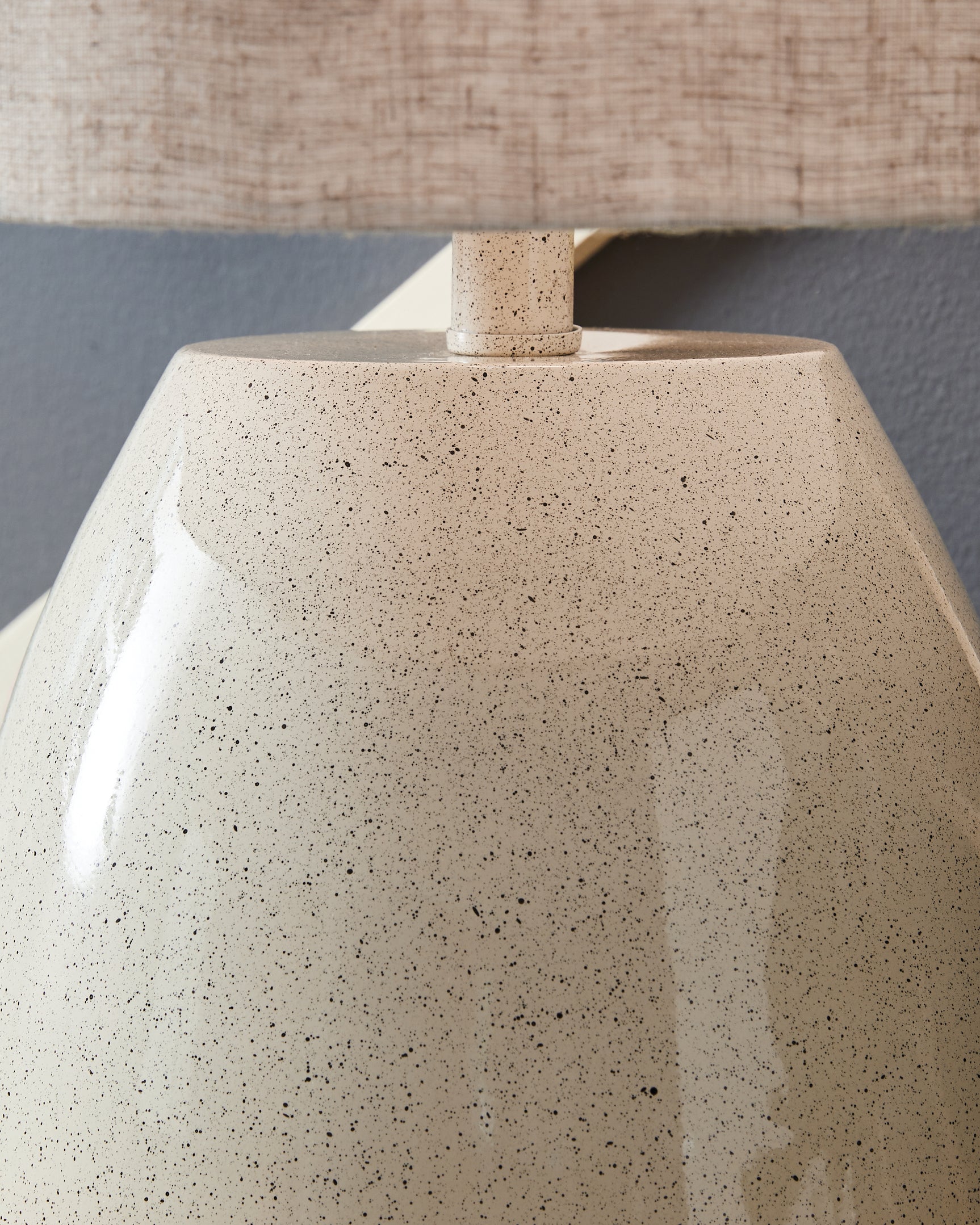 Close-up of Linas table lamp fabric drum shade and base finish