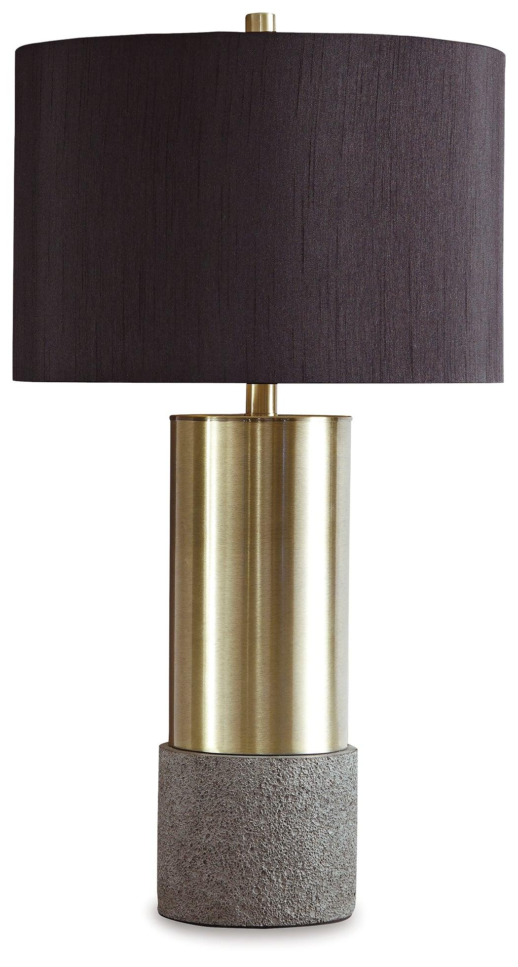 Close-up of Jacek table lamp base showing gray faux concrete texture and brass accents