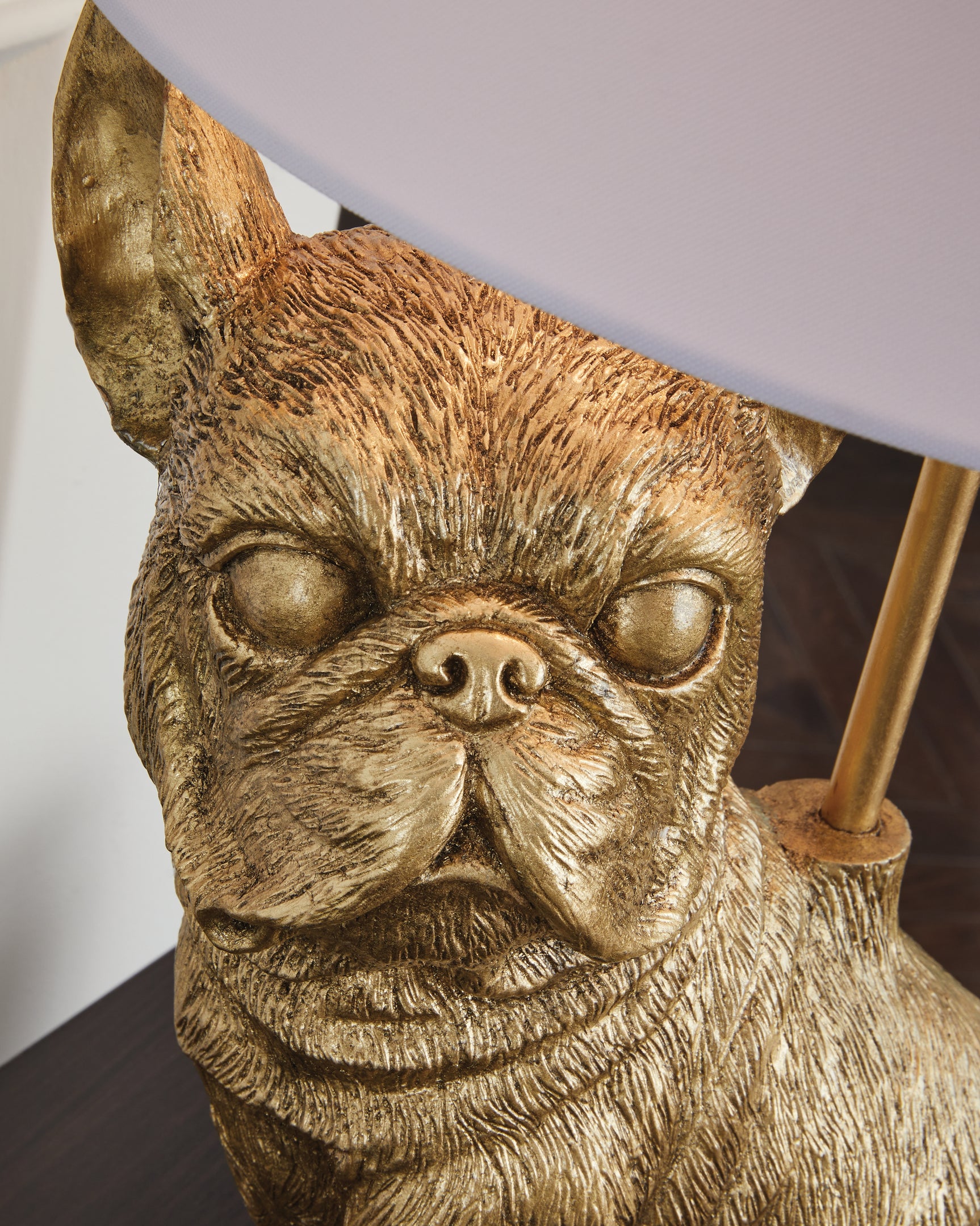 Close-up of the fabric drum shade on Wadeland gold finish lamp