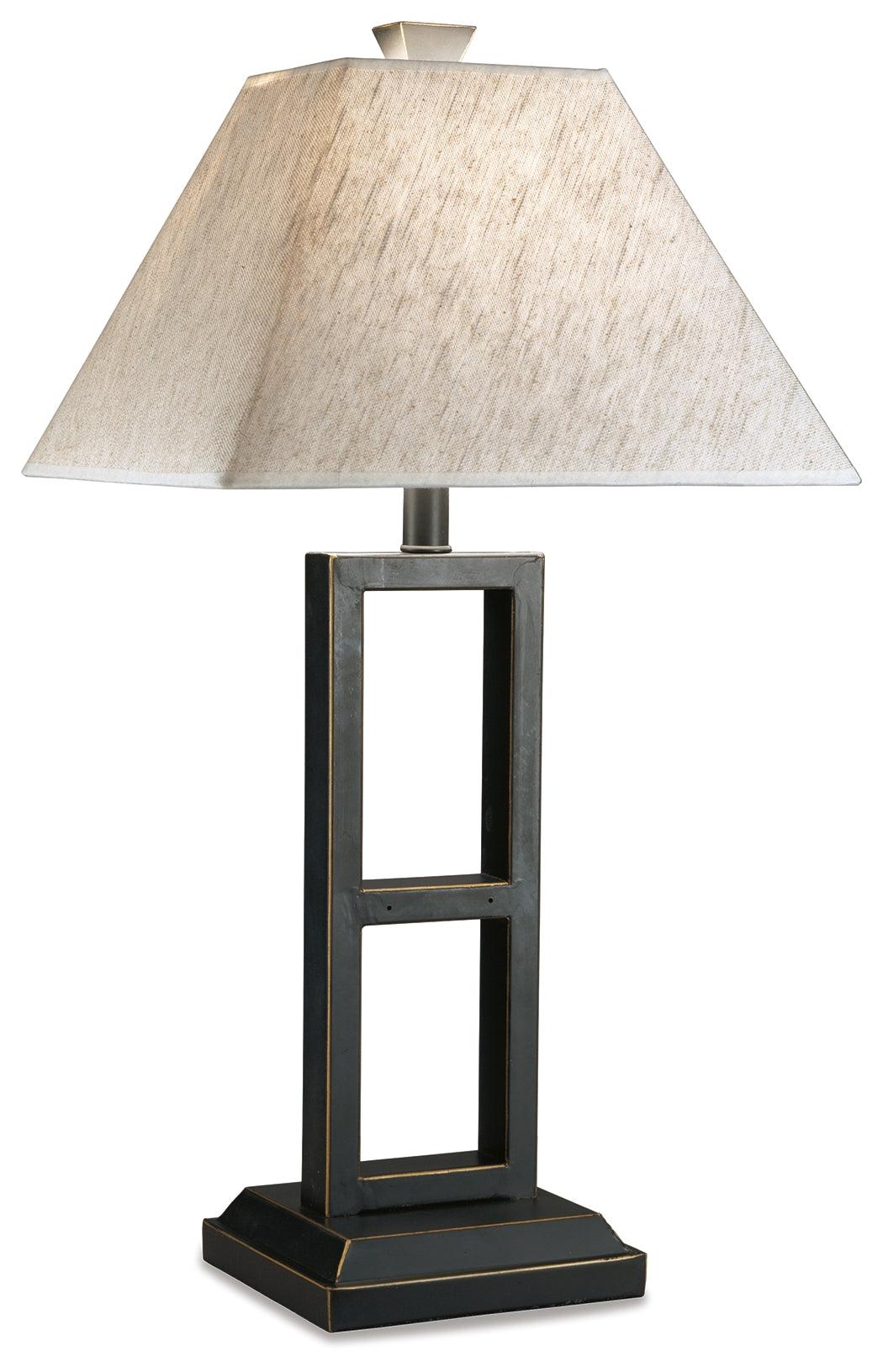 Pair of Deidra black table lamps lighting a living room corner