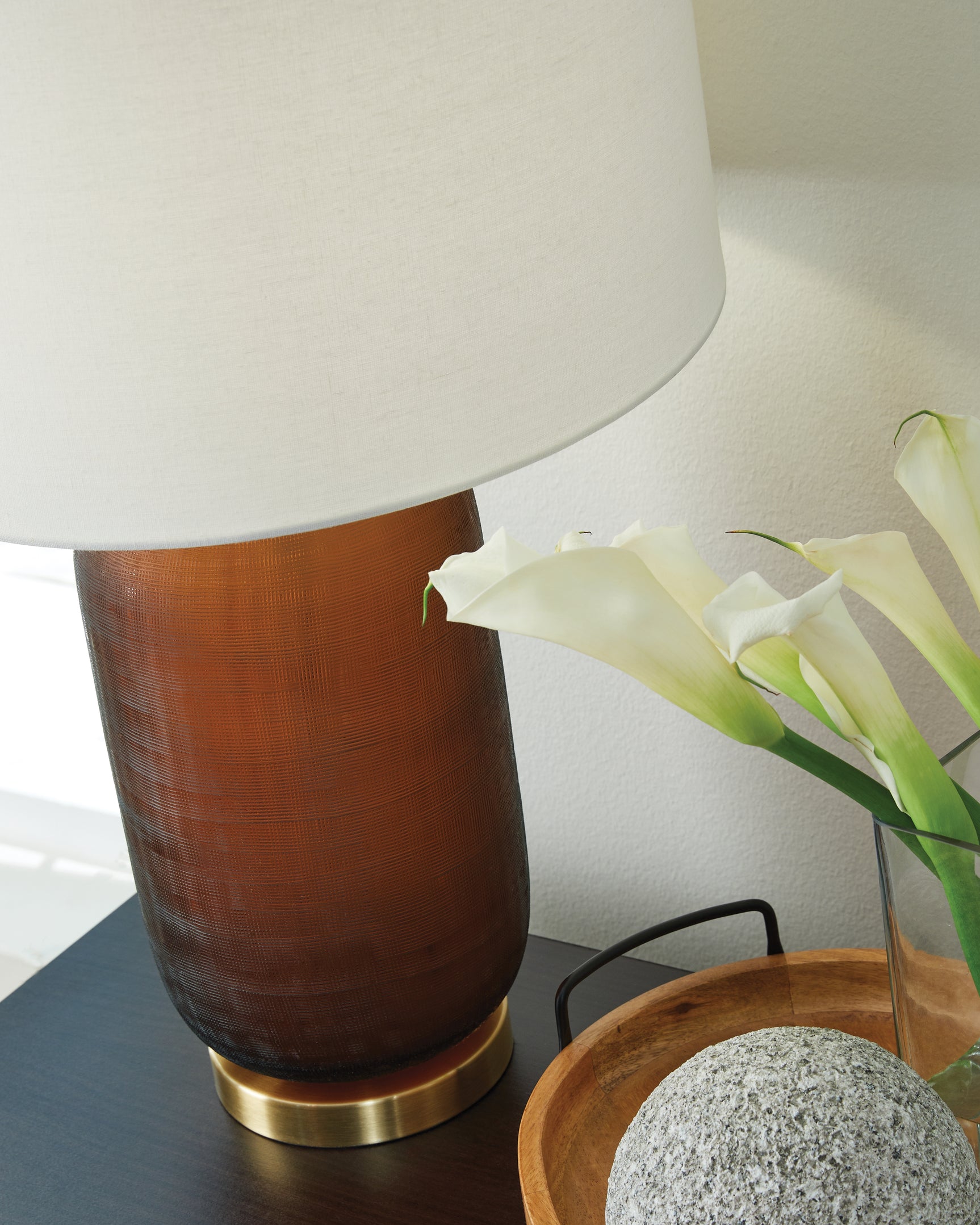 Detail of amber glass base and goldtone accents on Farberman lamp