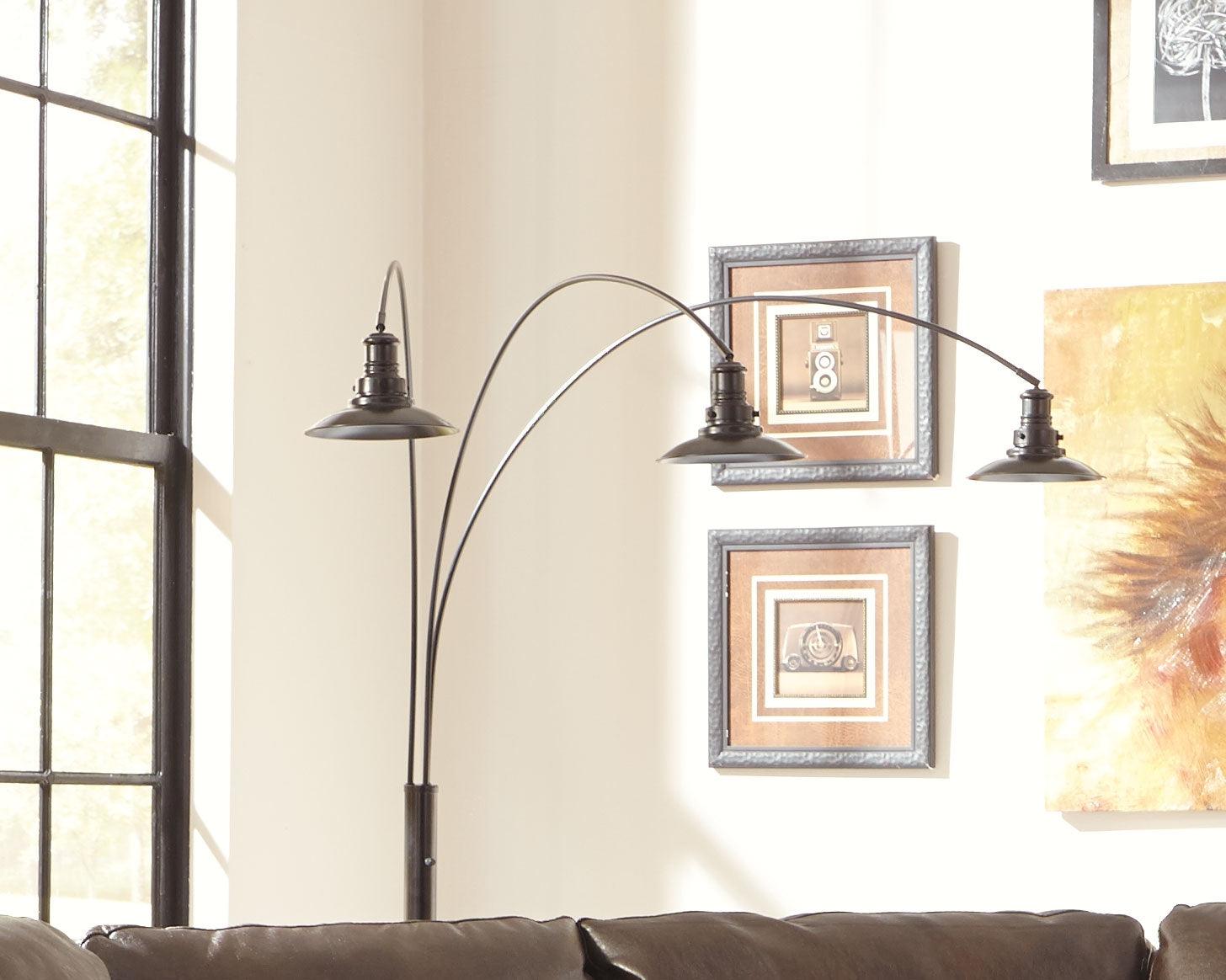 Sheriel Floor Lamp illuminated in a living room setting