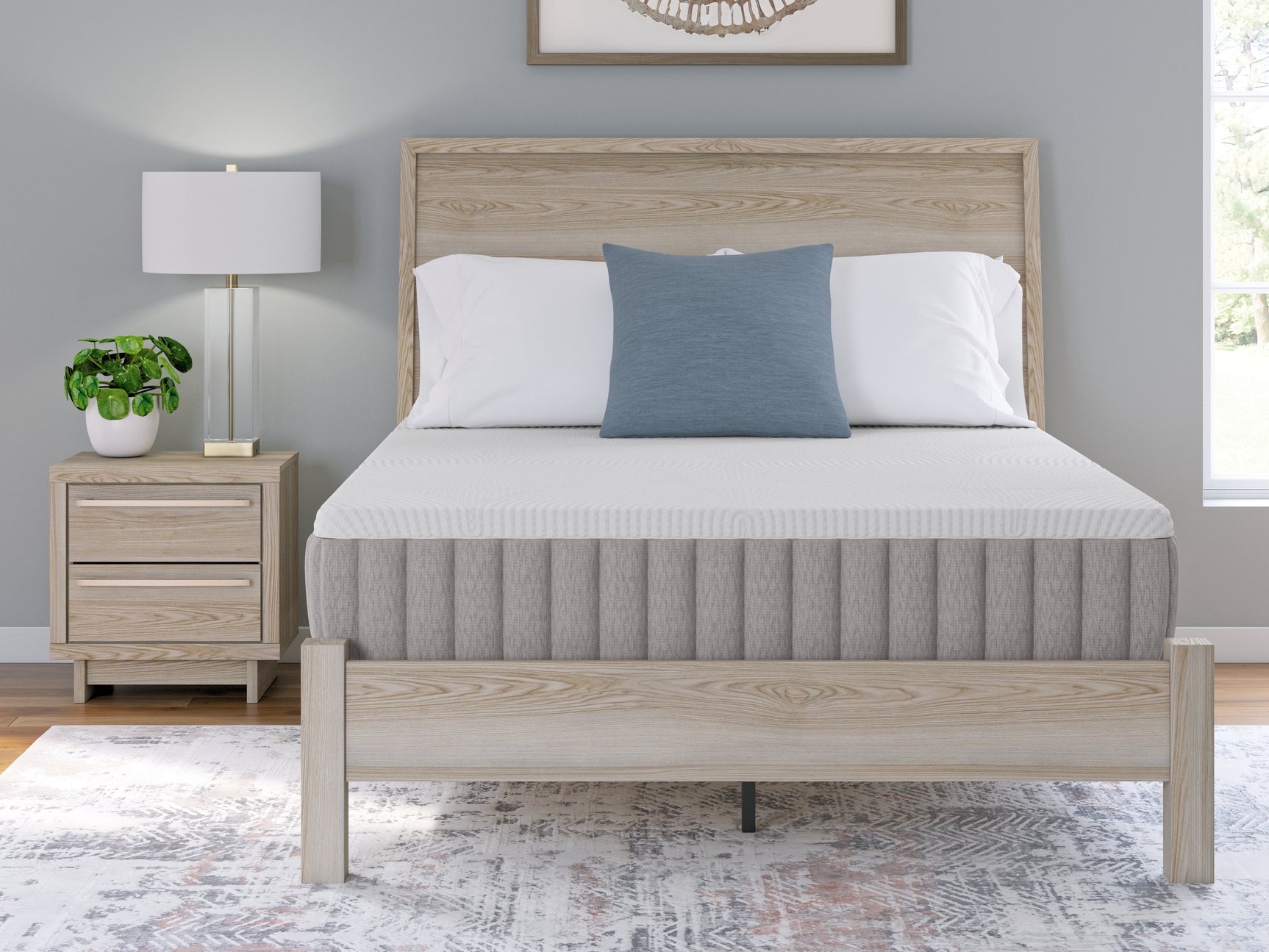 Hand pressing mattress top to show firmness