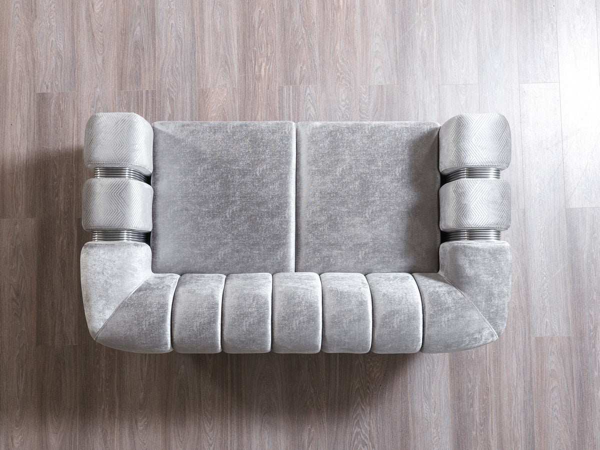 Angled detail of silver velvet upholstery