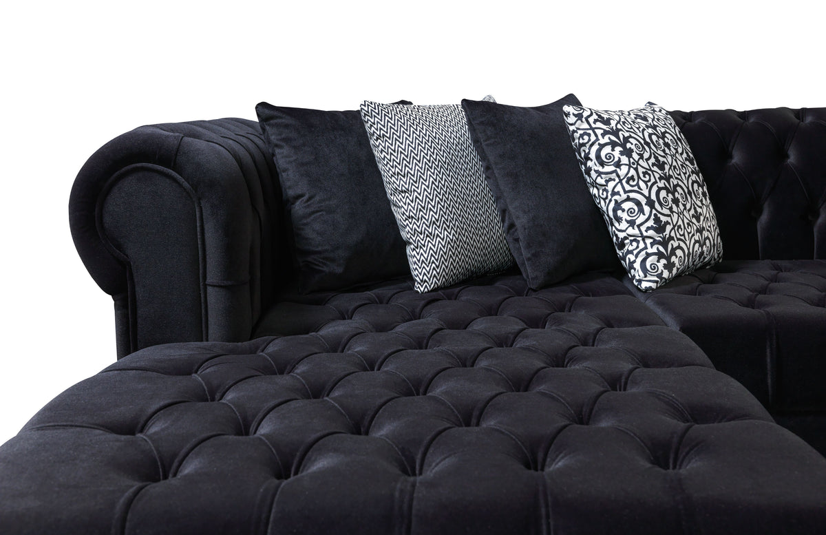 Room setting featuring the Emma Black Velvet sectional sofa
