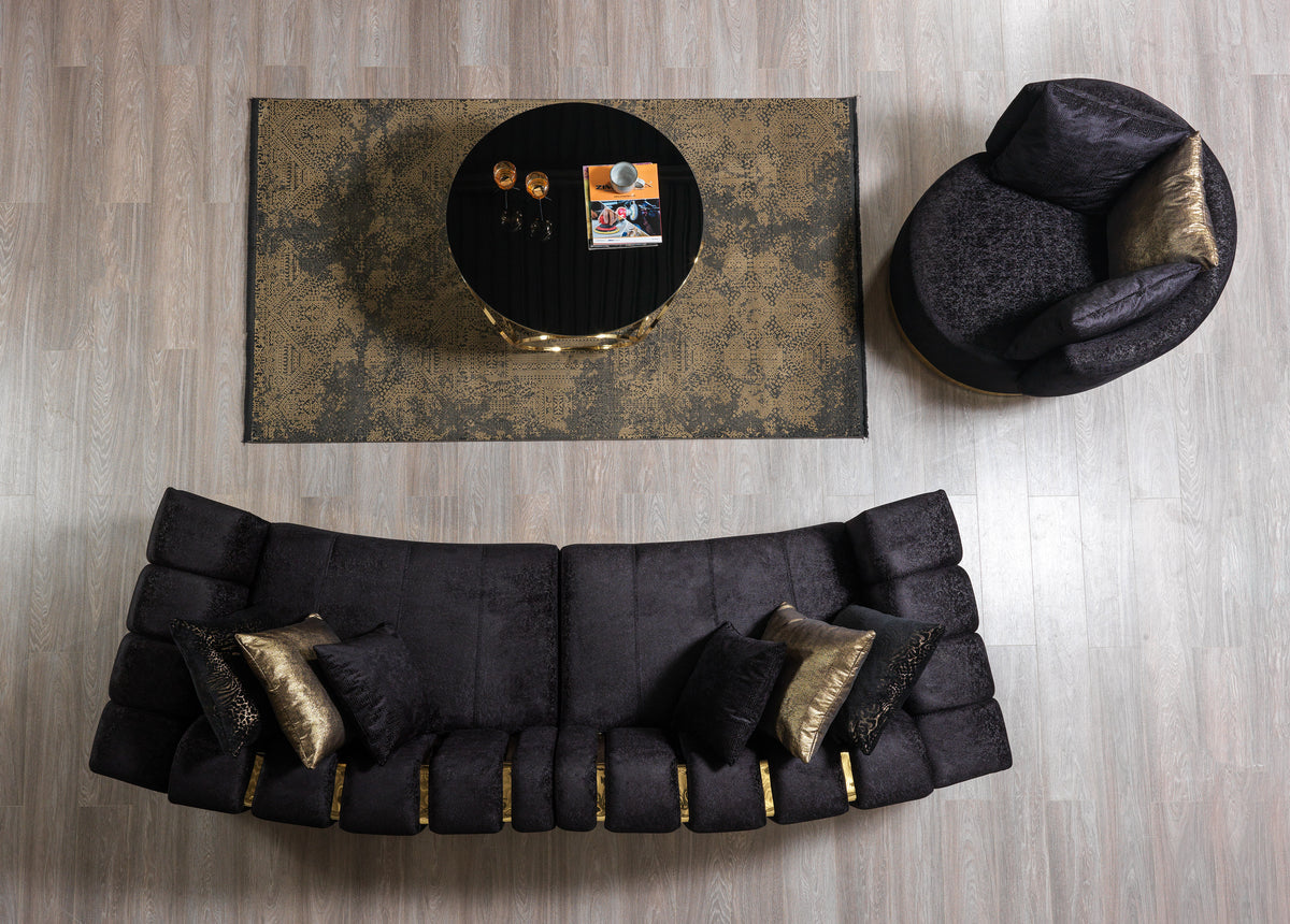 Profile view of curved sectional sofa in black velvet
