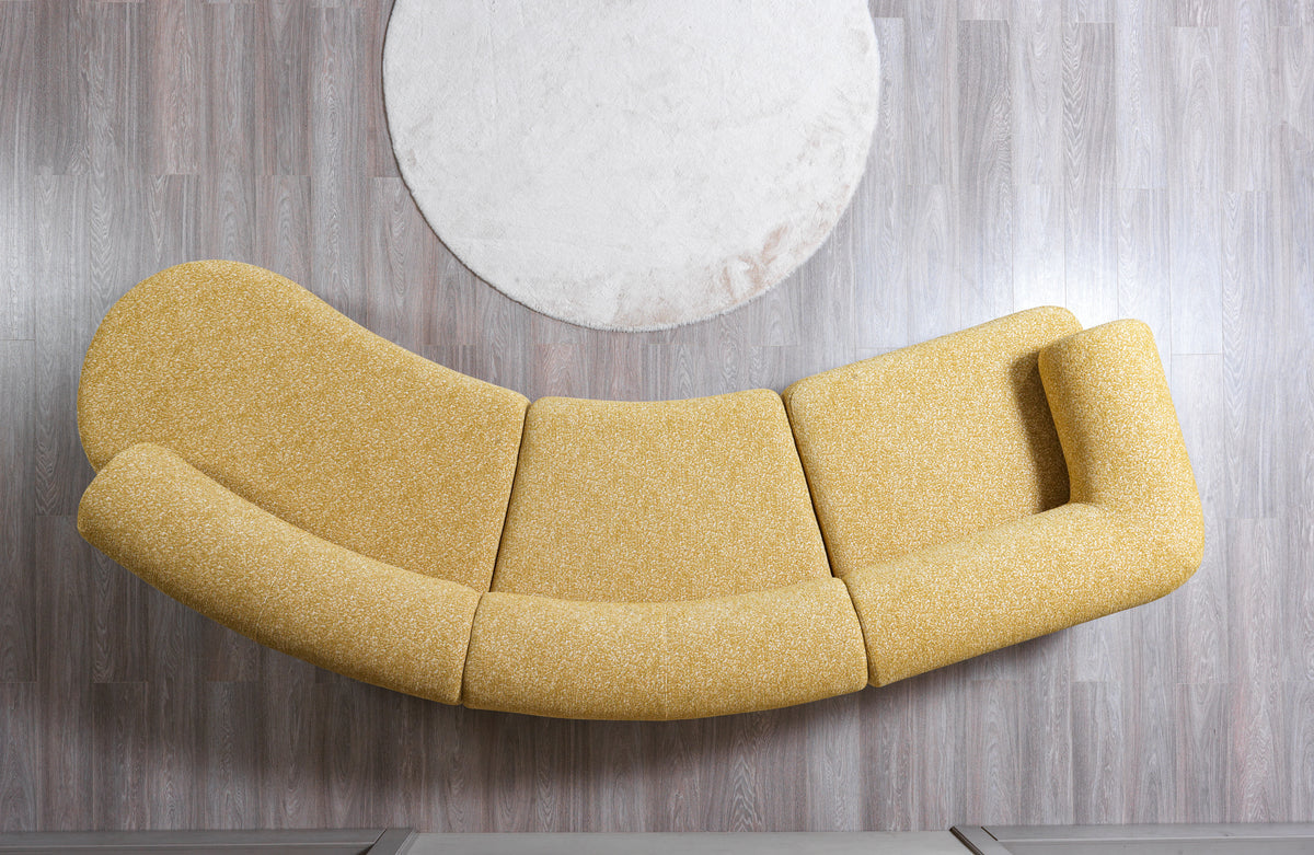 Front view of Esmeralda mustard boucle curved sectional sofa