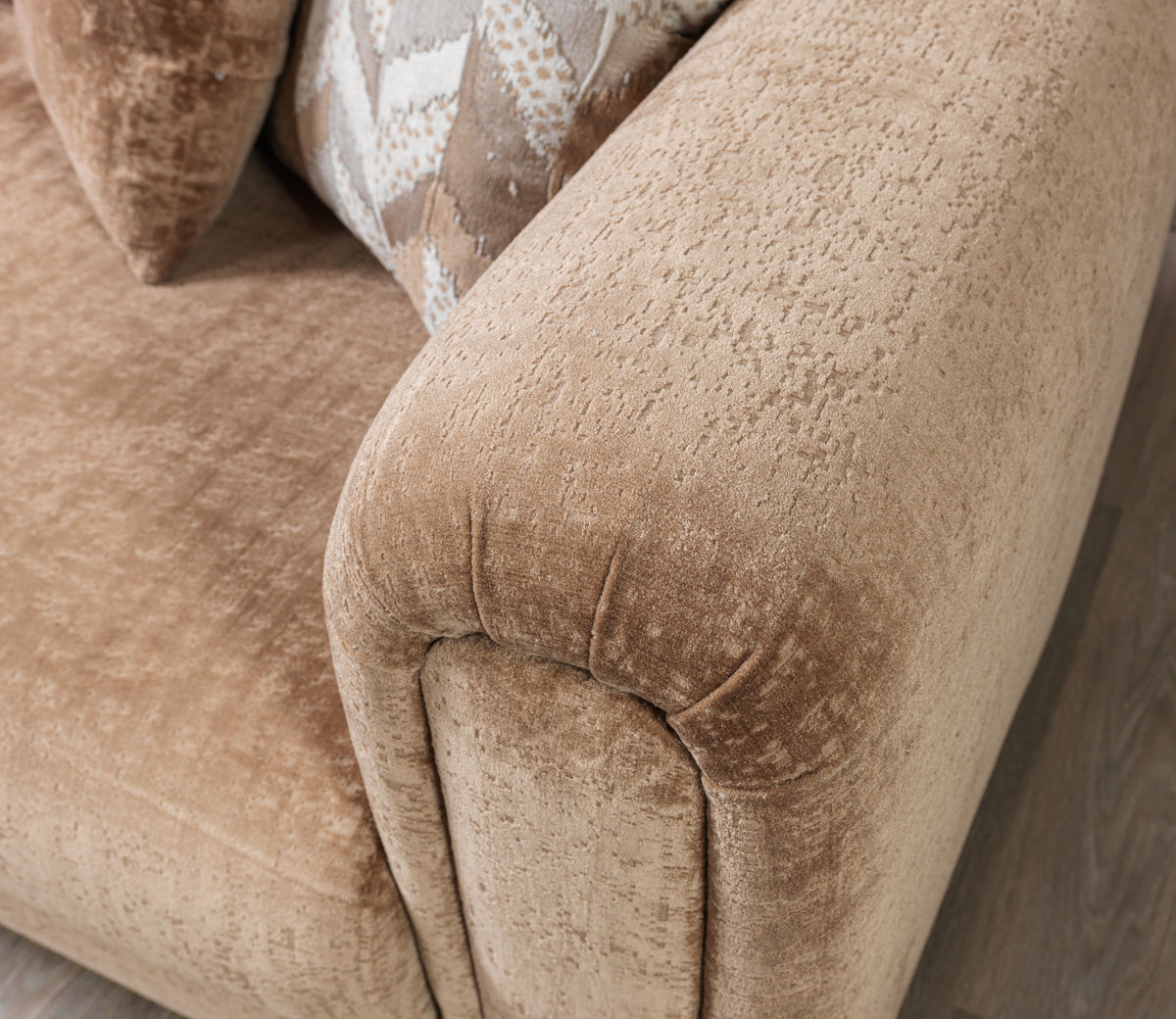 Side profile of coffee boucle loveseat