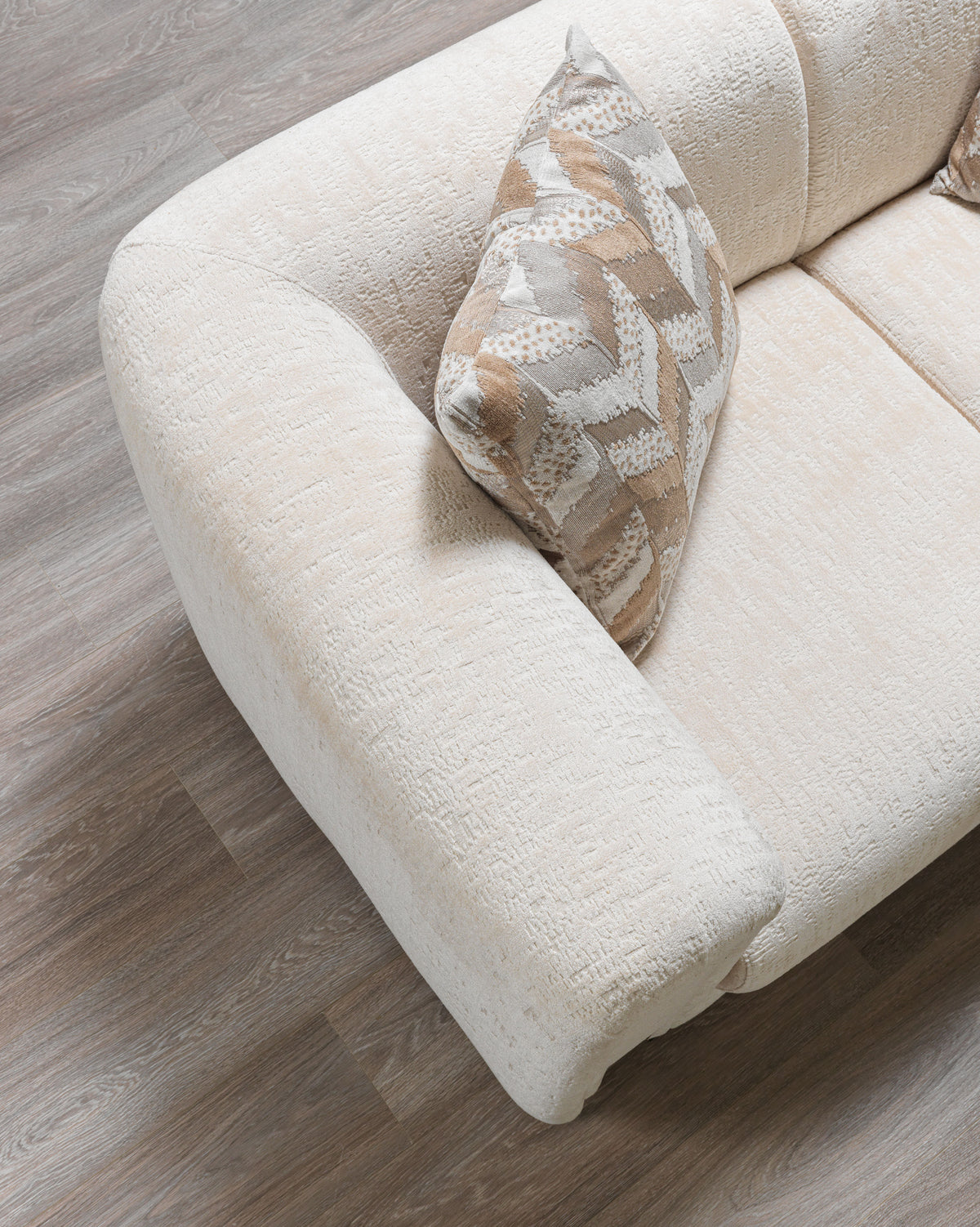 Detailed image focusing on armrest and fabric texture