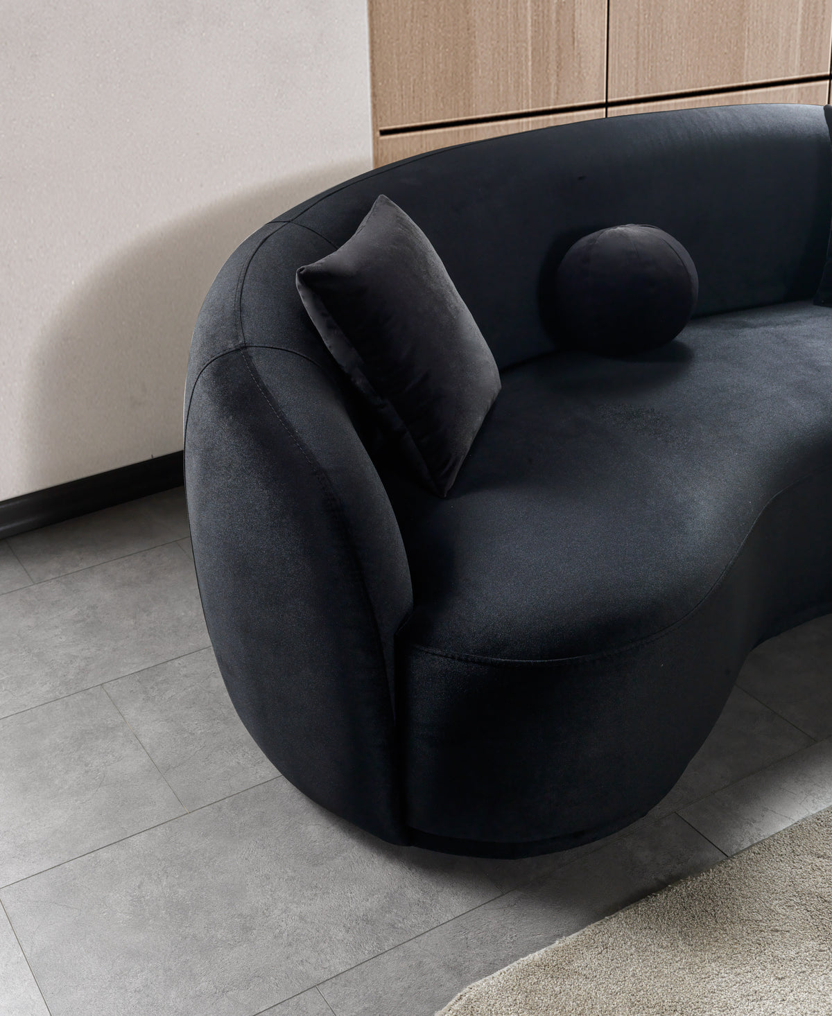 Close-up detail of Emily black velvet sofa fabric