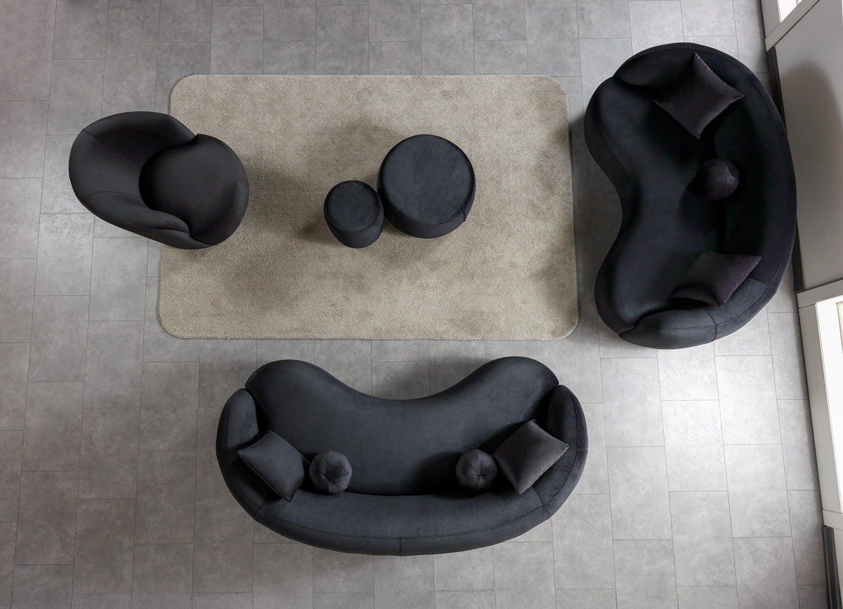 Ava Stool shown in room setting with black velvet fabric
