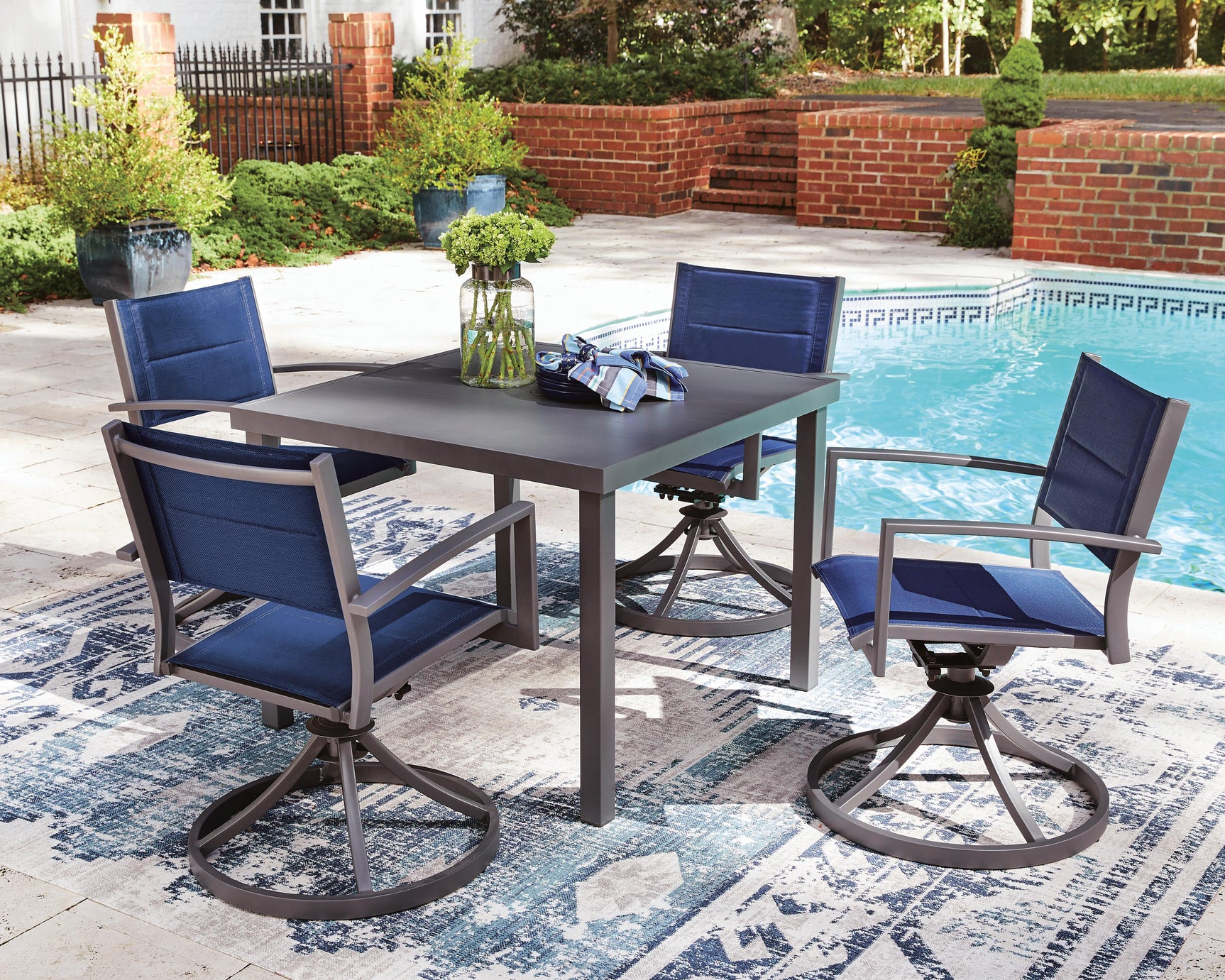 Angled view highlighting blue padded sling chairs