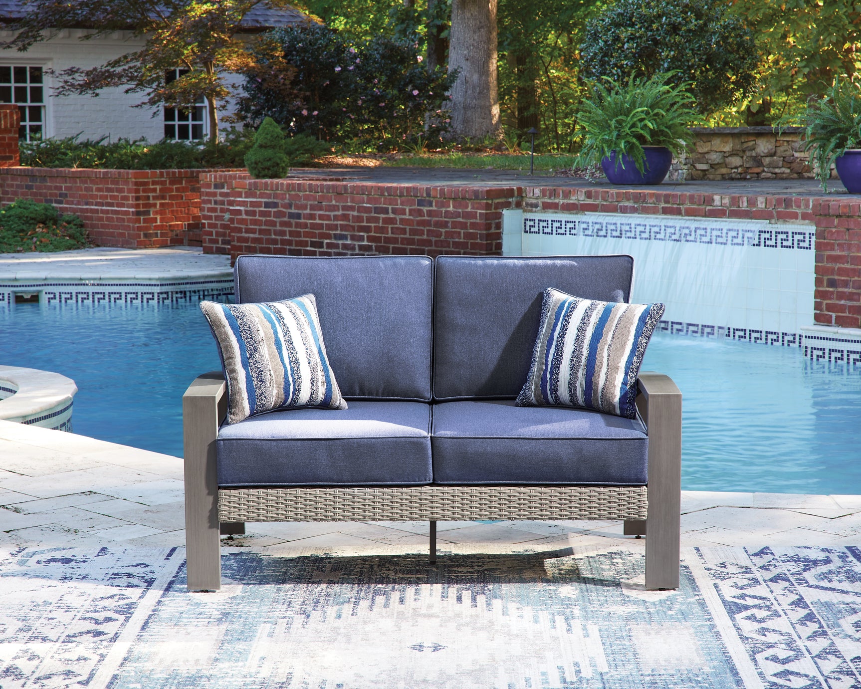 Blue gray sofa and loveseat, back view