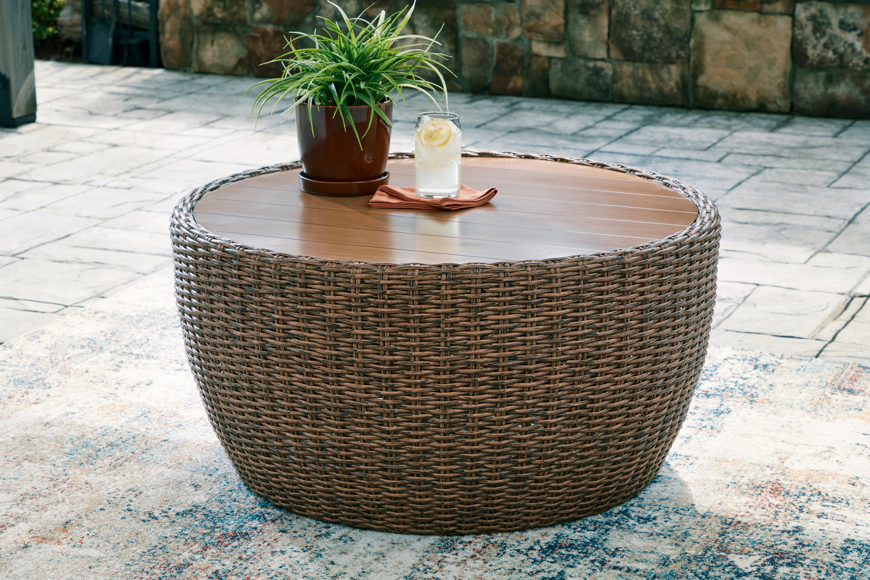Double beige outdoor sofa set with loveseat, lounge chairs, and coffee table