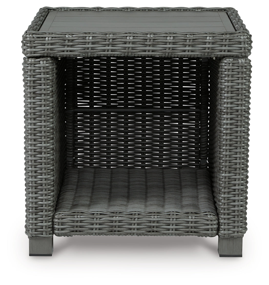 End table side angle showcasing frame and wicker